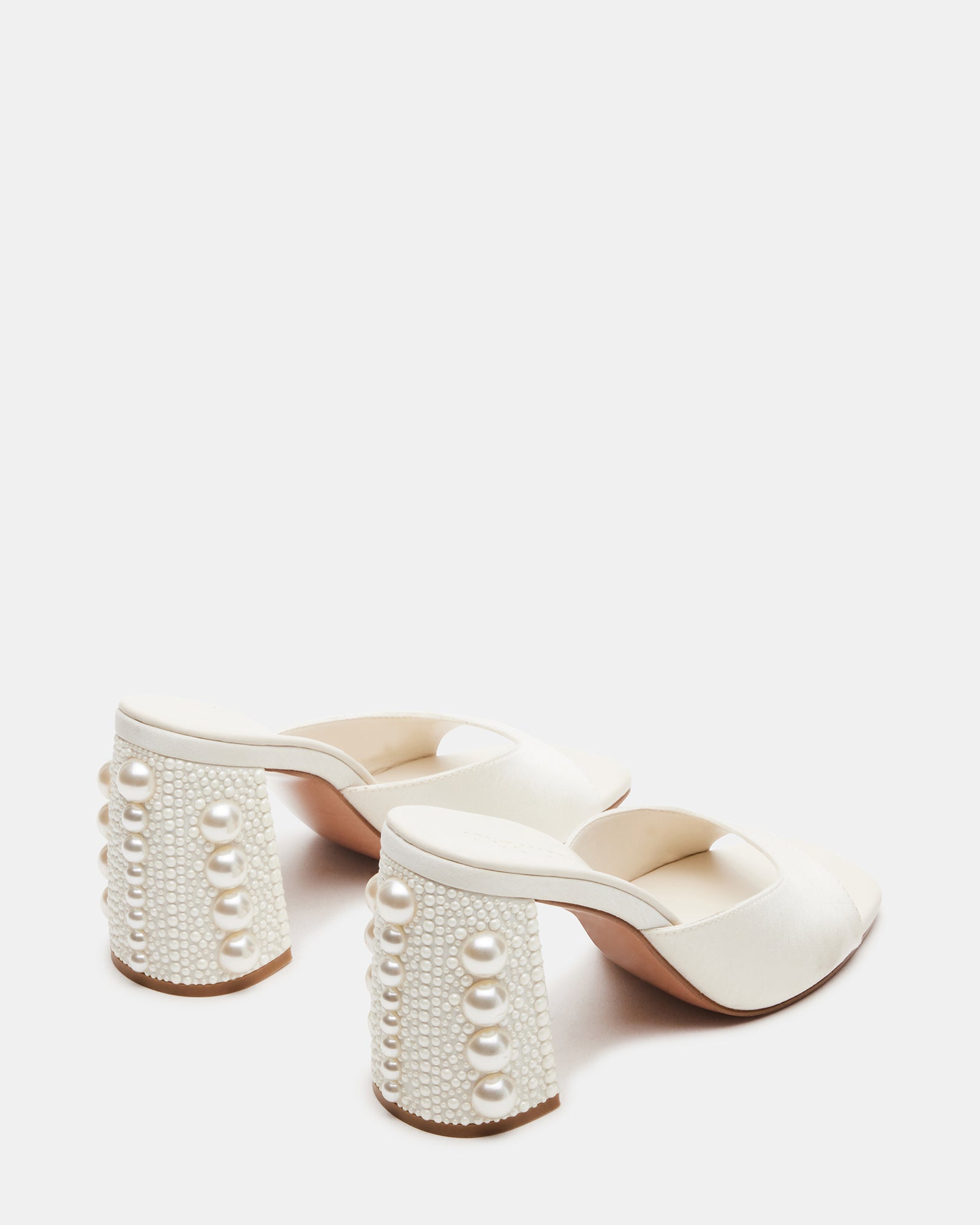 Top-down angle of kitten heel mules shoes styled with a summer dress