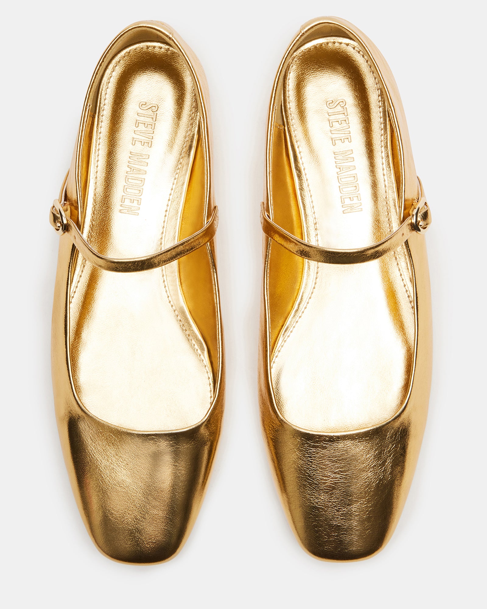 Close-up of brown leather flats highlighting texture and craftsmanship