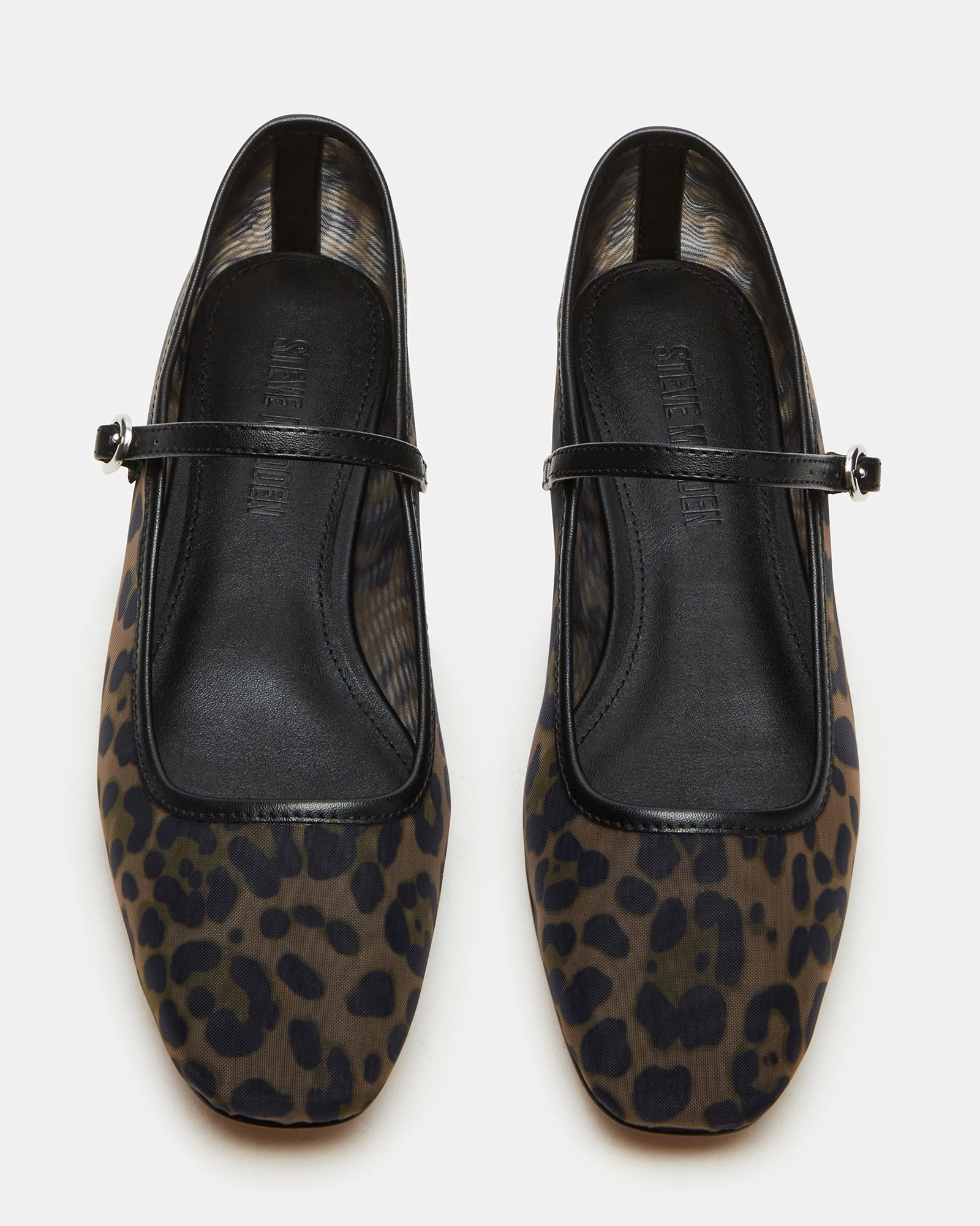 Side view of leopard-print ballet flats on hardwood floor