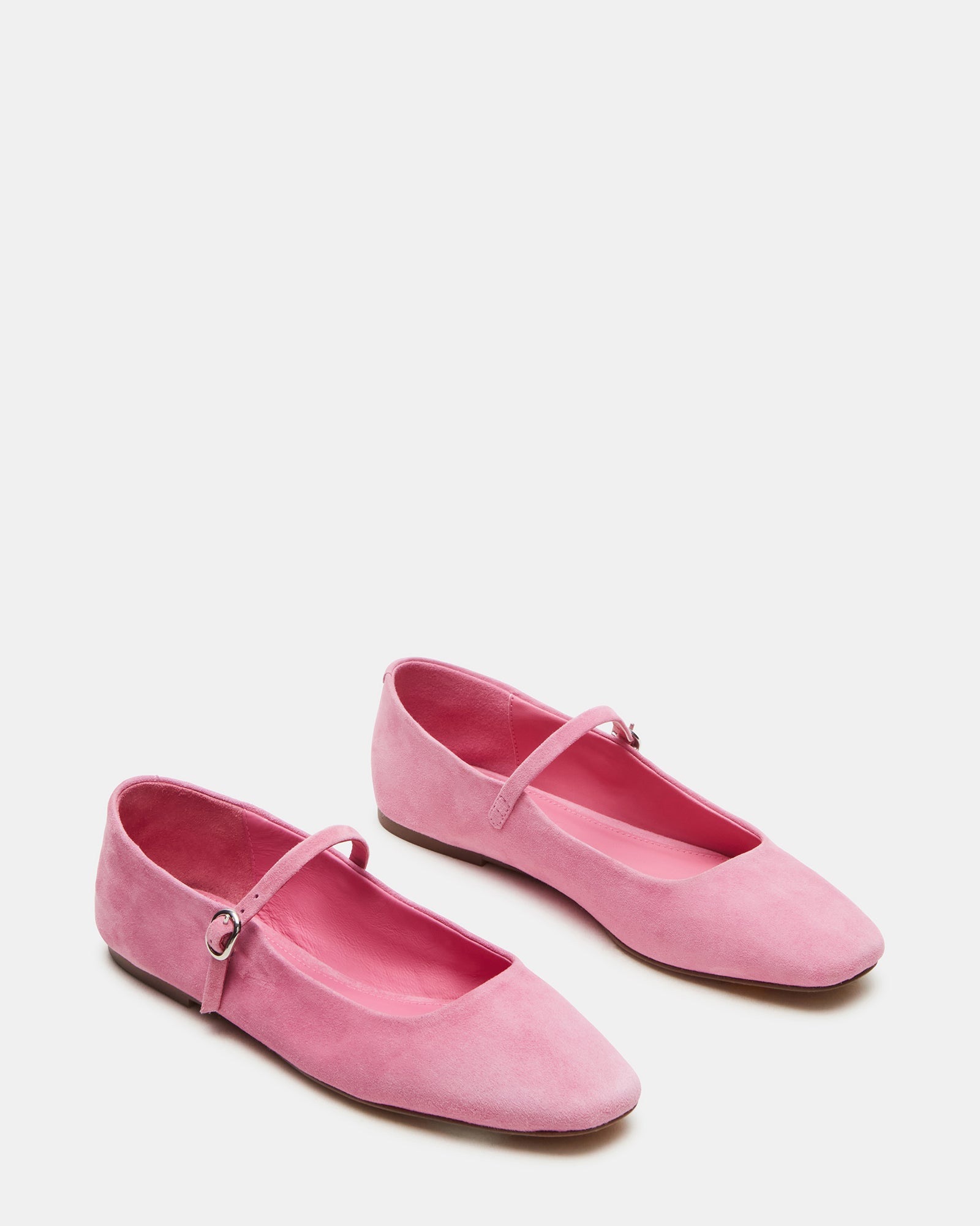 Top-down view of black ballet flats revealing Mary Jane style strap.