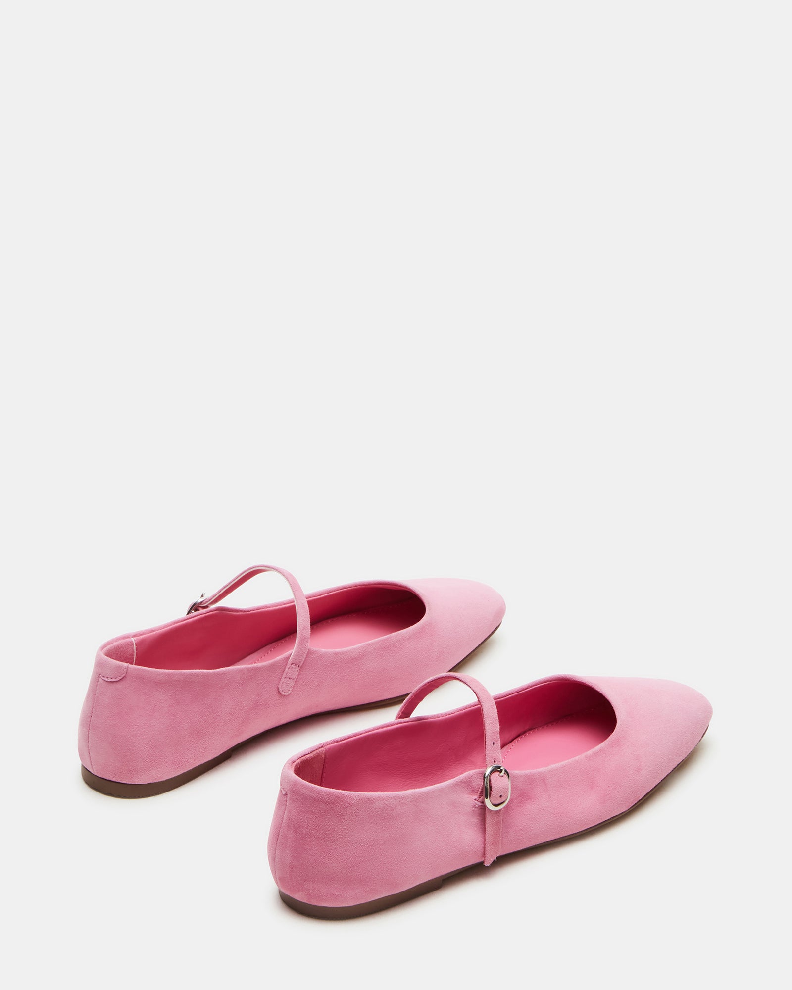 Top-down view of black ballet flats revealing Mary Jane style strap.