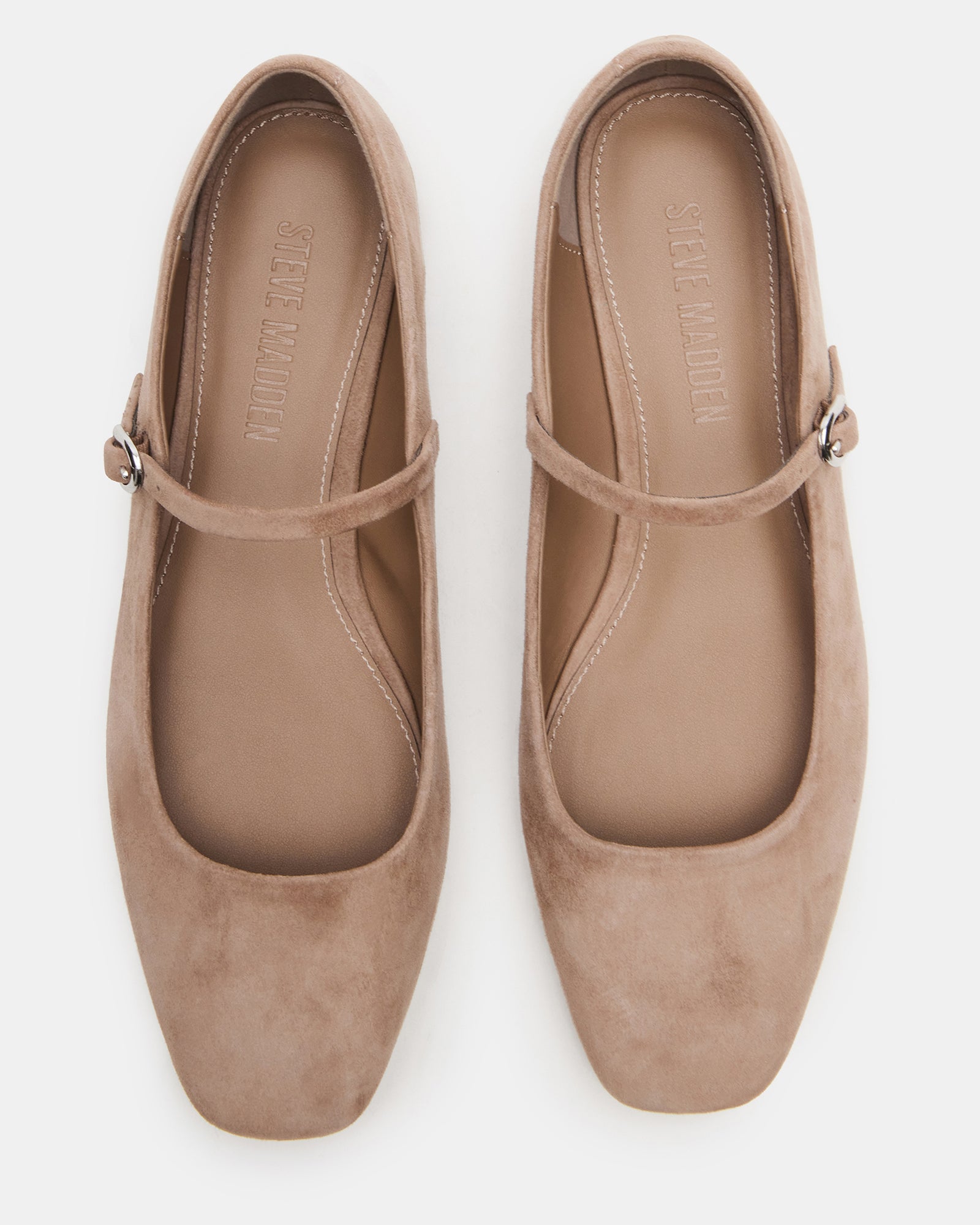 Side profile of red ballet flats styled with cropped jeans for casual Southern walks