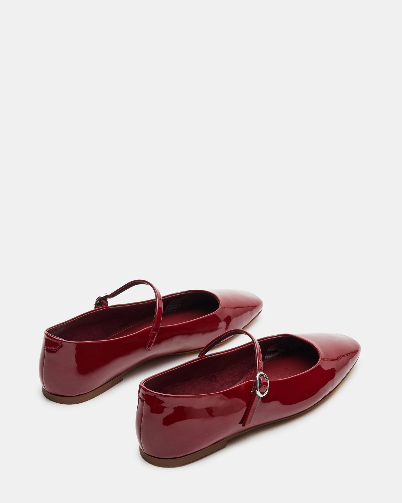 Overhead angle of square toe flats paired with spring outfit and accessories