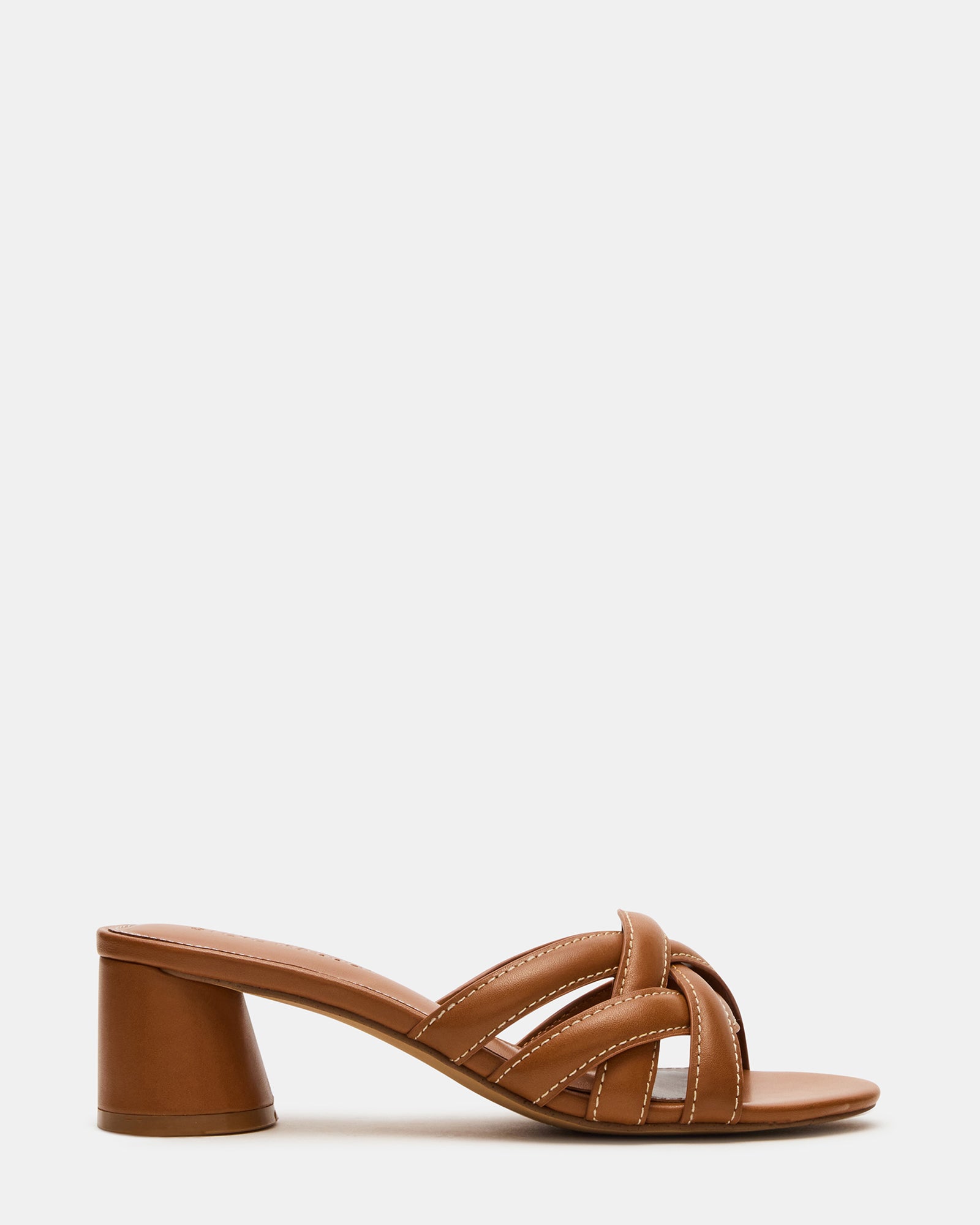 Close-up of tan leather block heel mule shoes showcasing stitching detail