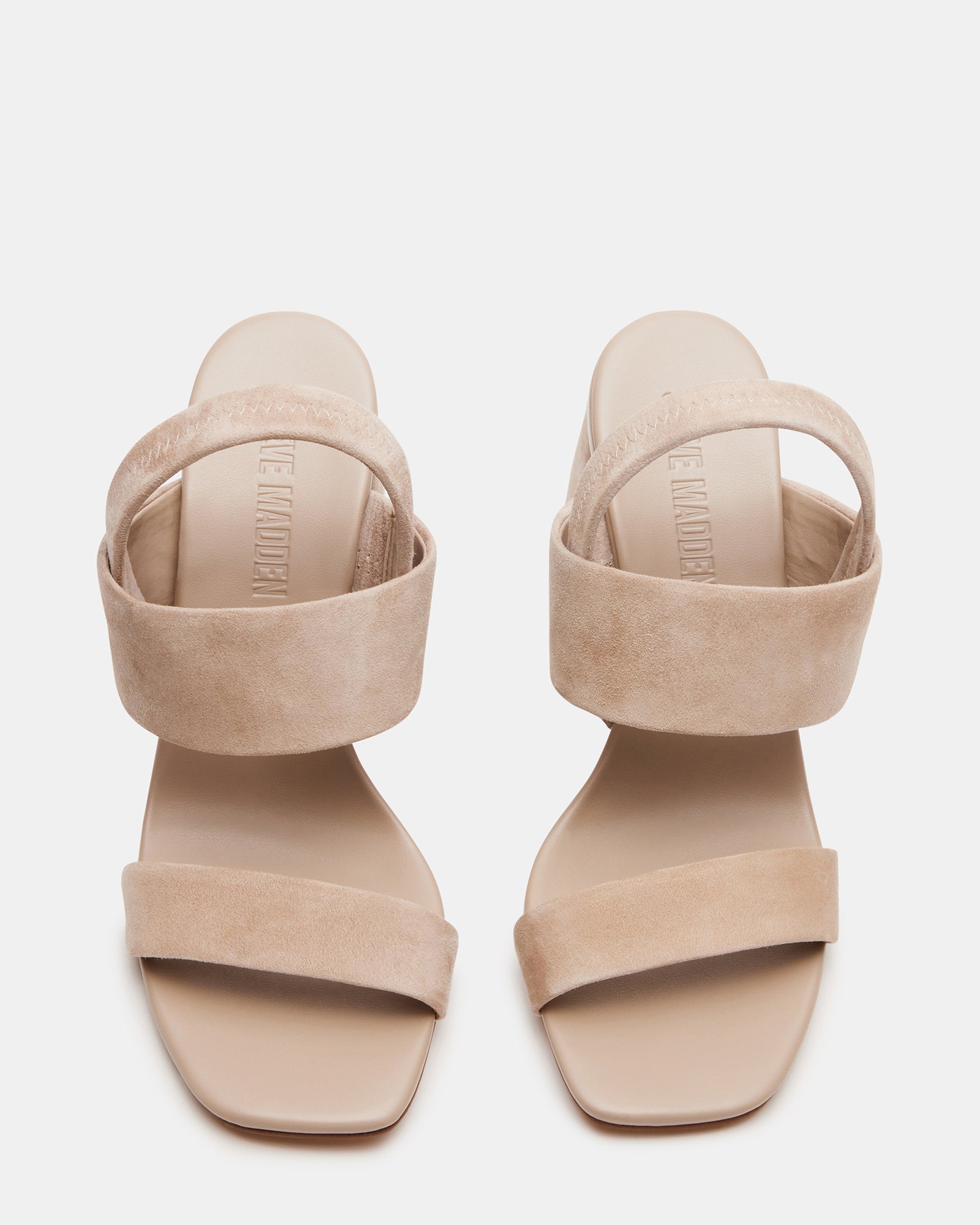 Front angle of white block heel sandals paired with denim for weekend errands