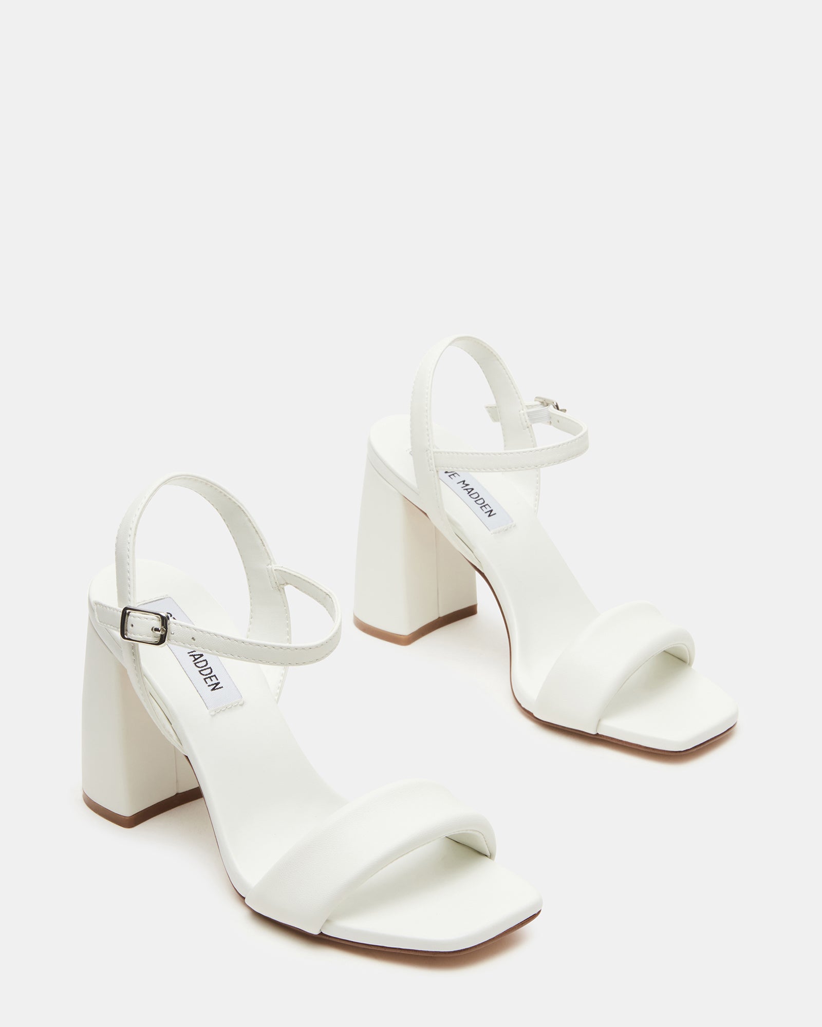 Brown leather sandals displayed on a neutral background