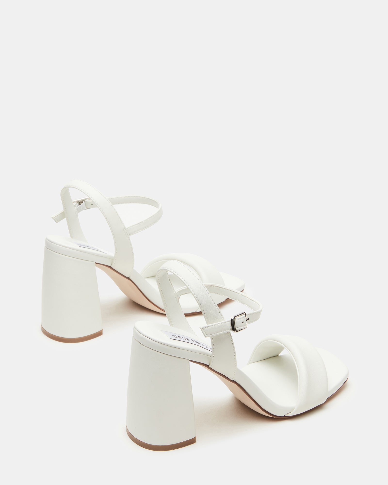 Brown leather sandals displayed on a neutral background