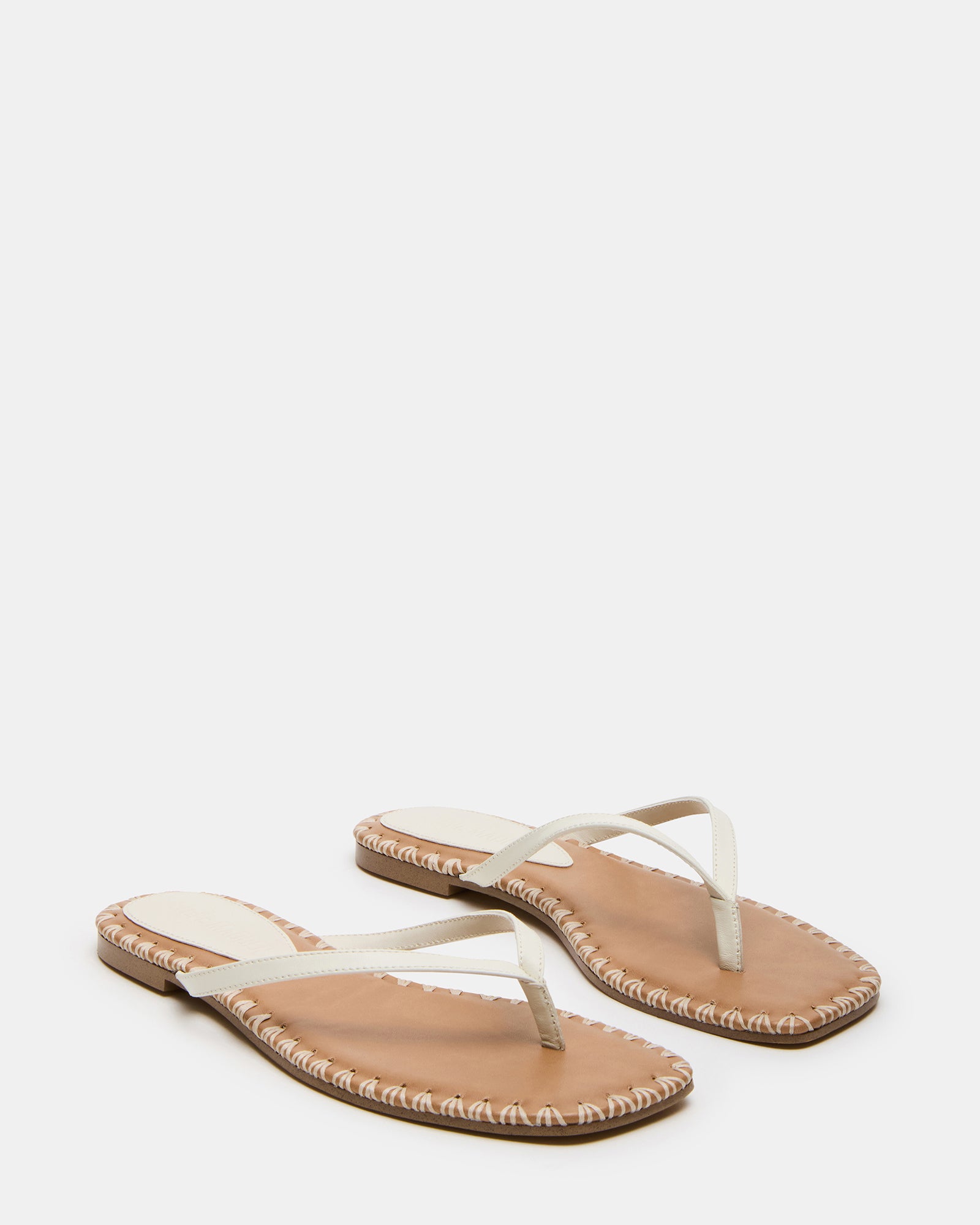 Close-up of leather texture and stitching on womens sandals