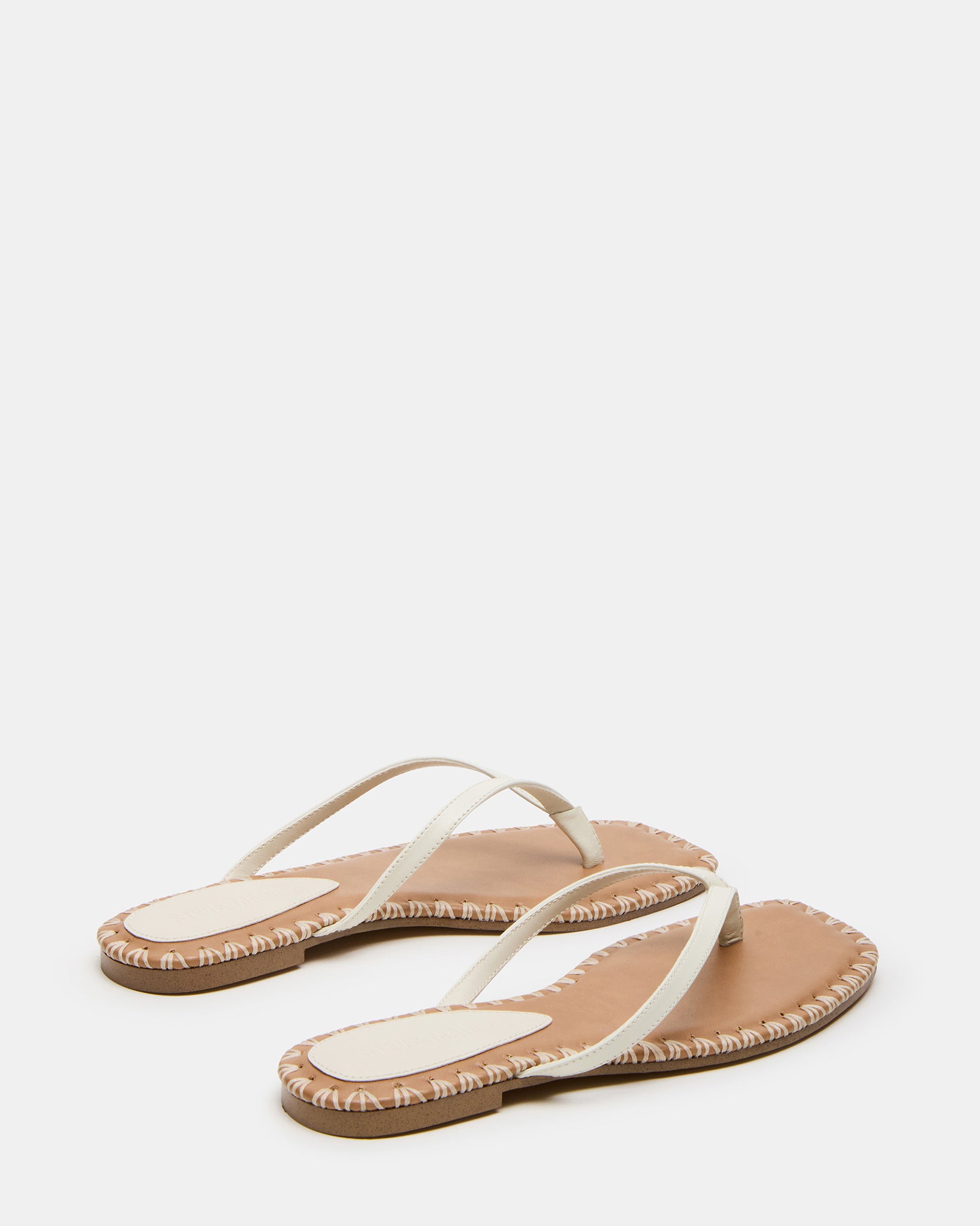 Close-up of leather texture and stitching on womens sandals