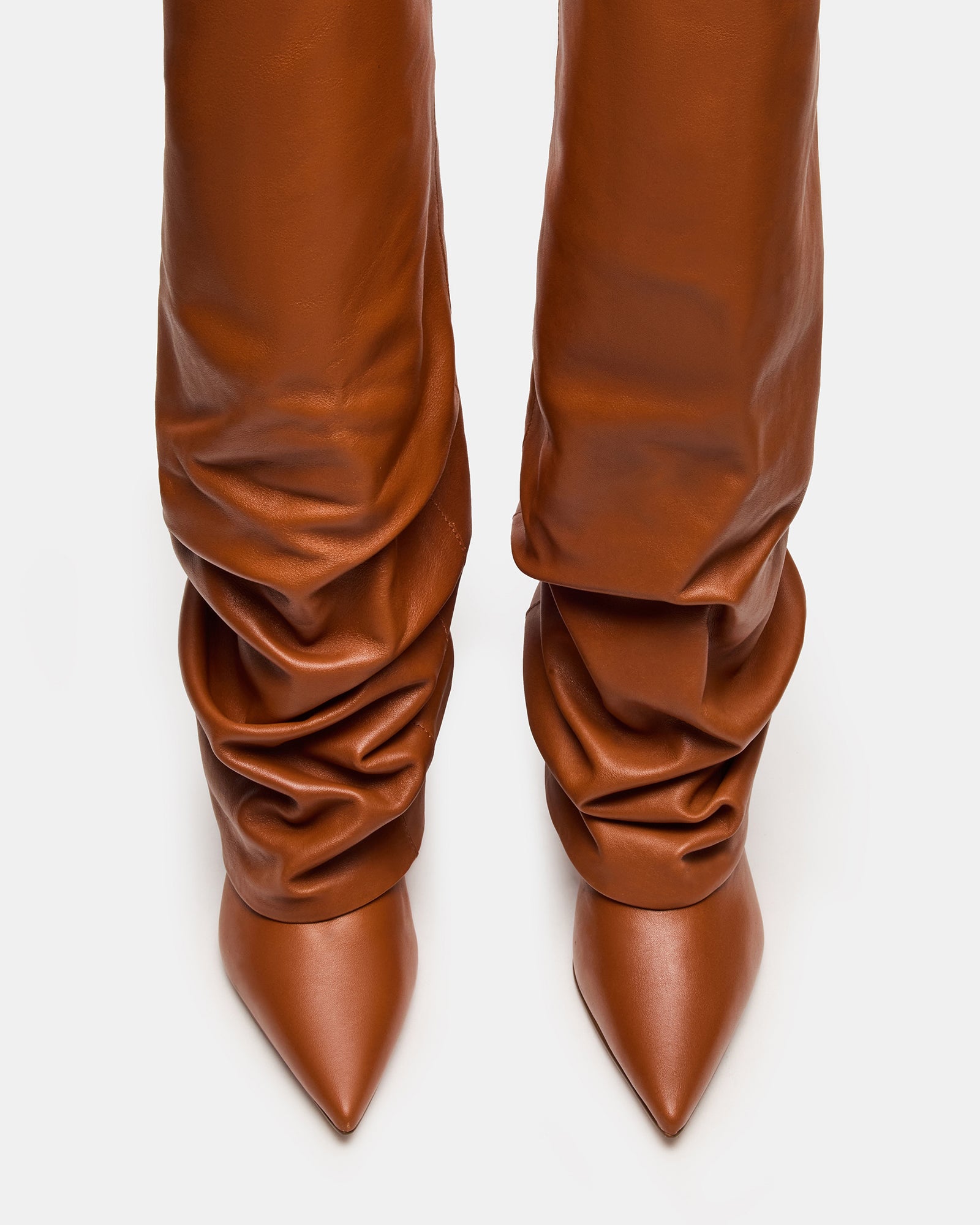 Side view of Marengo tan pointed toe boots with stiletto heel and cuff detail