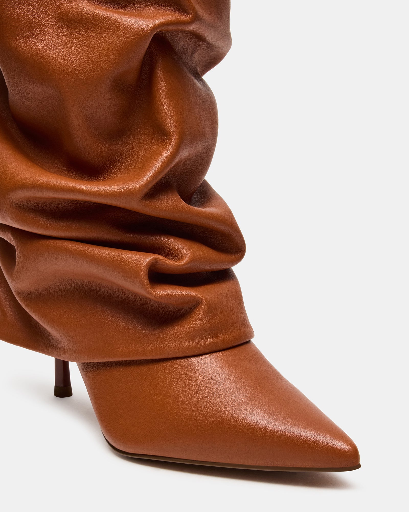 Back view of stylish tan leather boots with heel and fold-over cuff