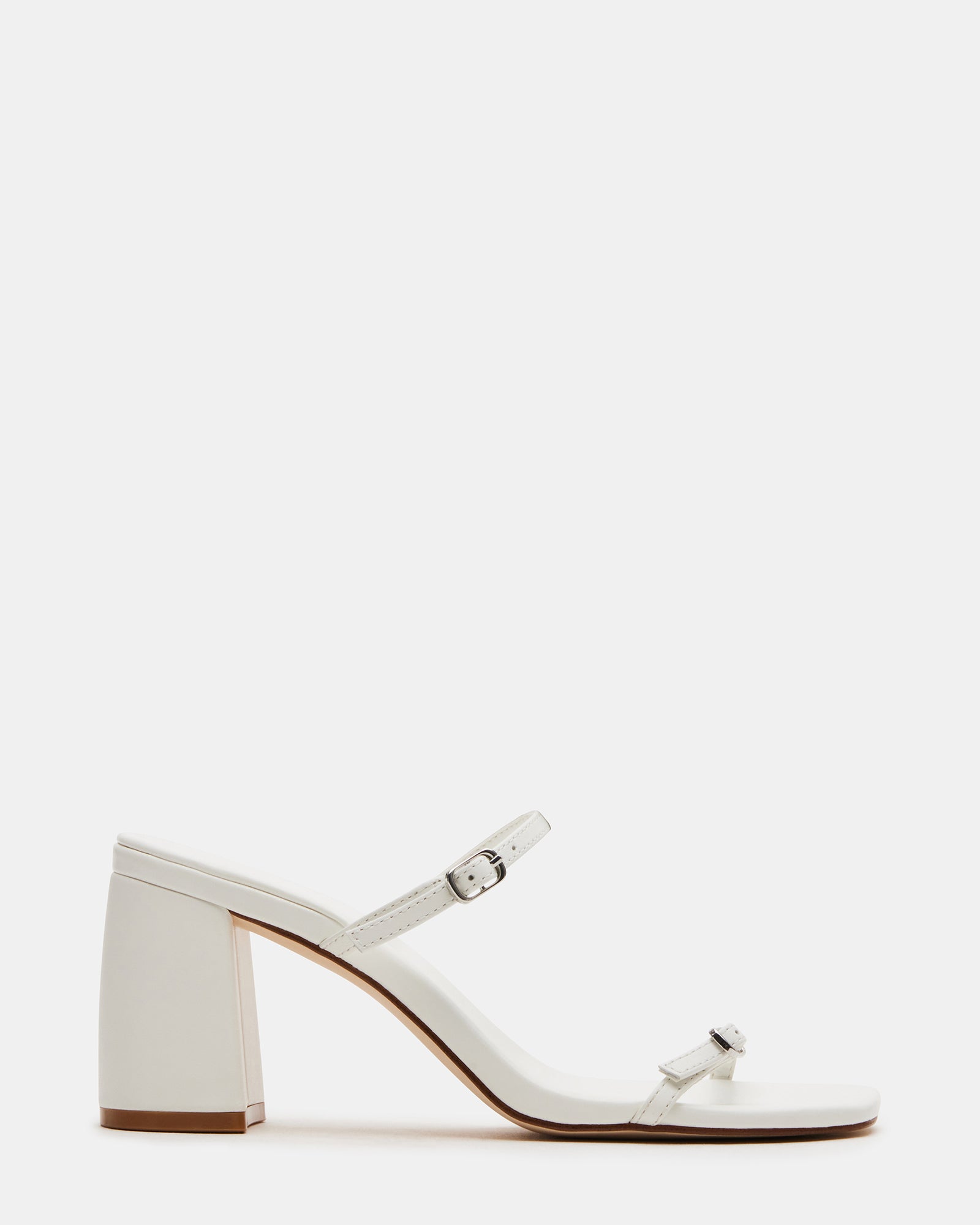 Front view of white strappy block heels highlighting square toe and leather finish