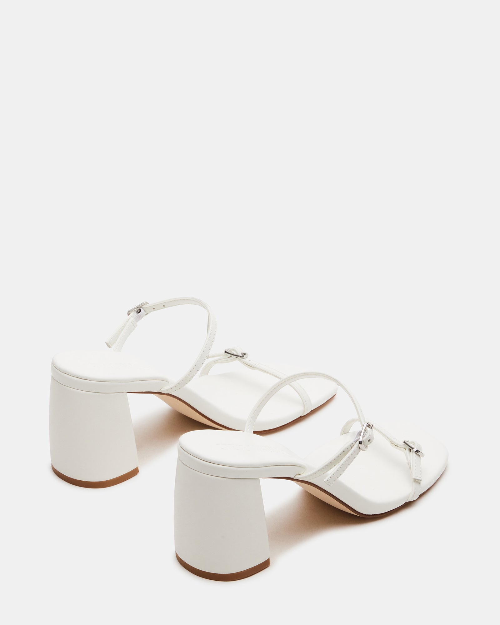 Side profile of Mariette Luxe mules showcasing 3.25-inch block heel and sleek straps