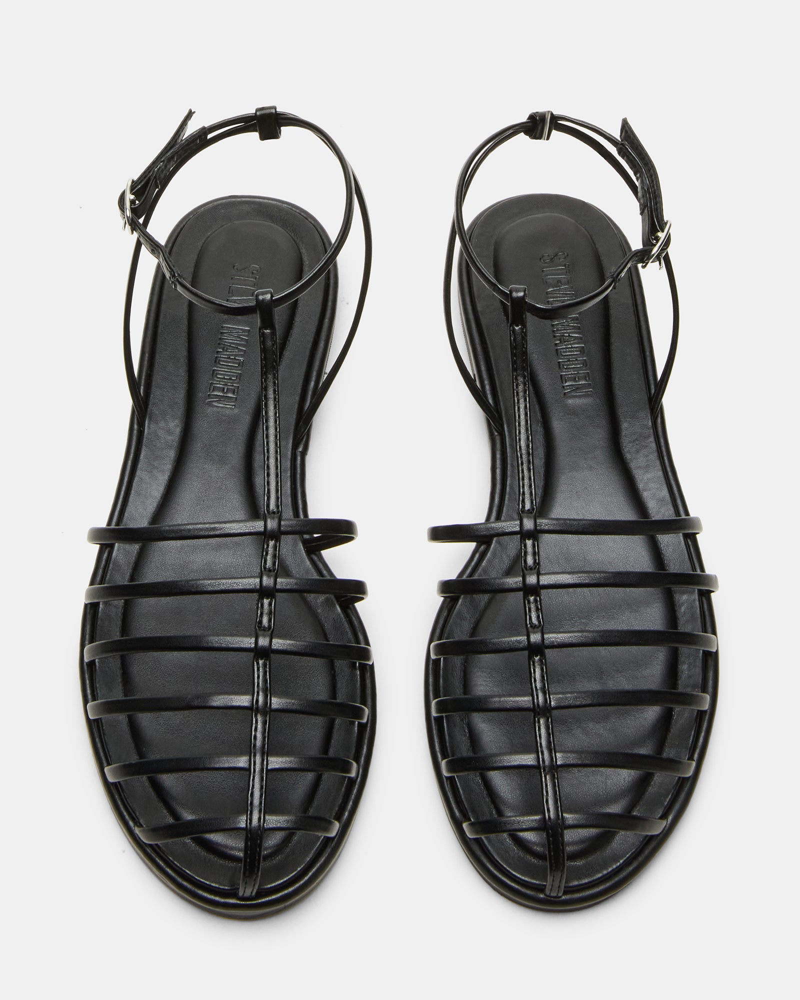 Close-up of the secure ankle strap on Marin Black vegan sandals.