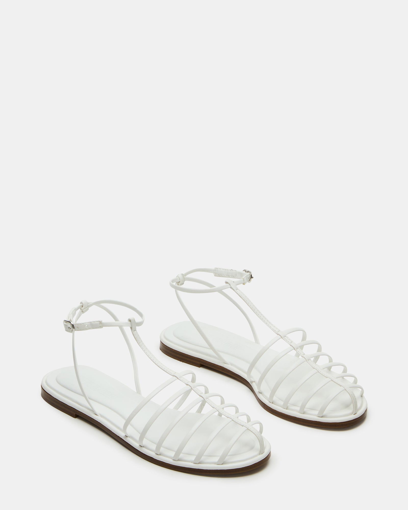 Outdoor shot of sandals worn in historic Charleston streets, showing flexible sole grip