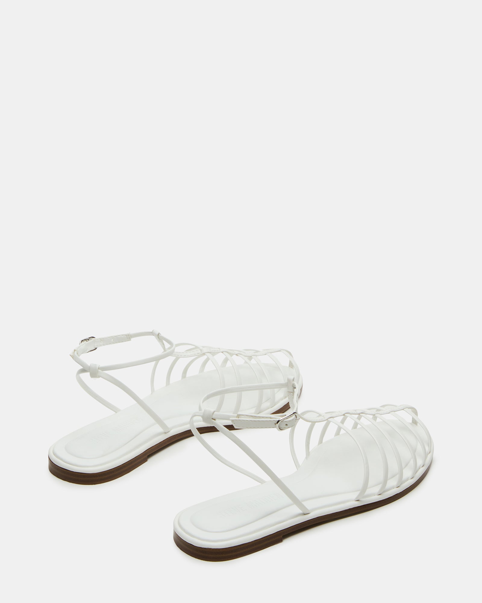 Outdoor shot of sandals worn in historic Charleston streets, showing flexible sole grip