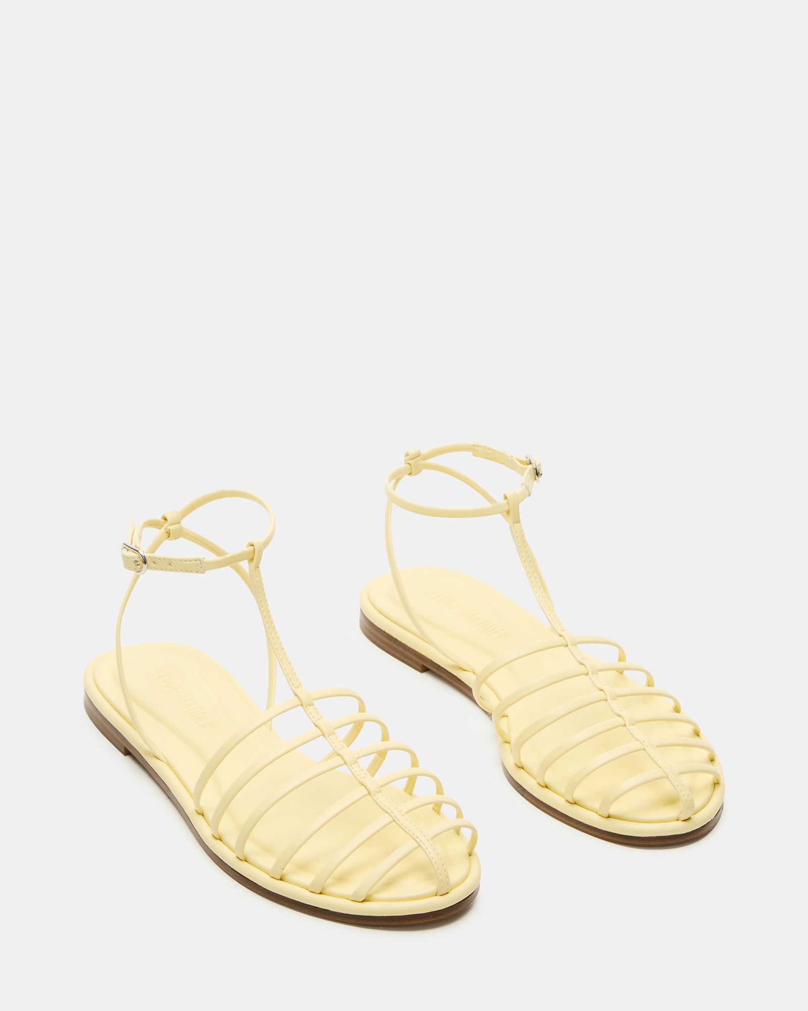Woman walking on the beach in Marin Breeze comfortable sandals.