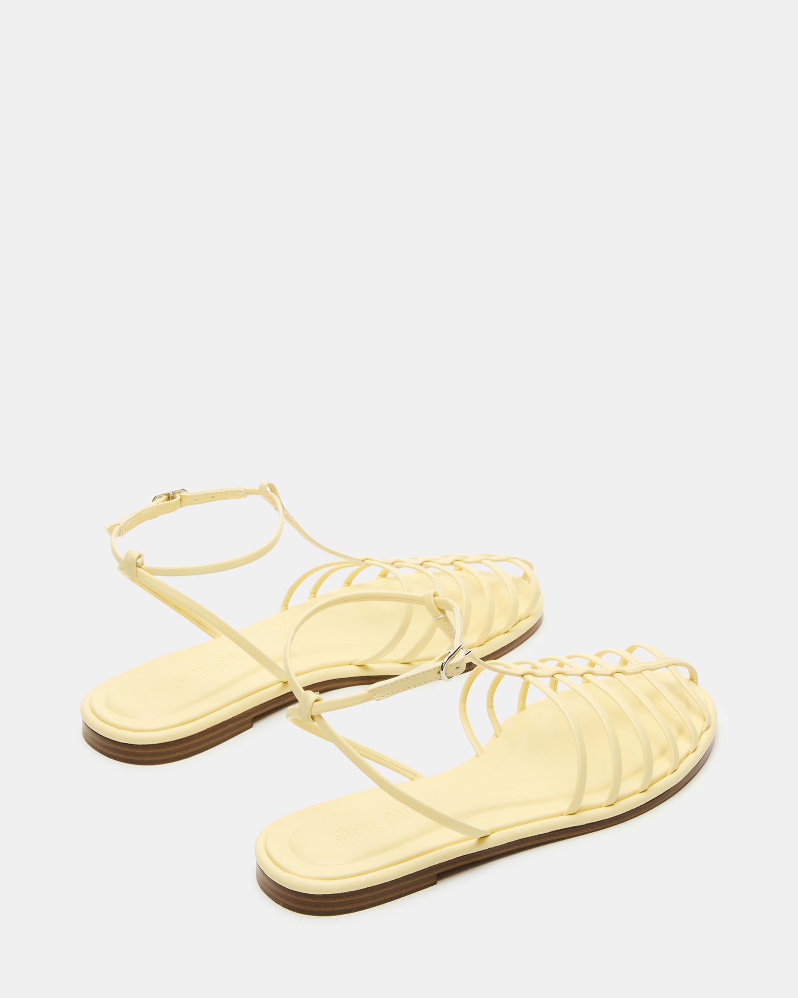 Woman walking on the beach in Marin Breeze comfortable sandals.