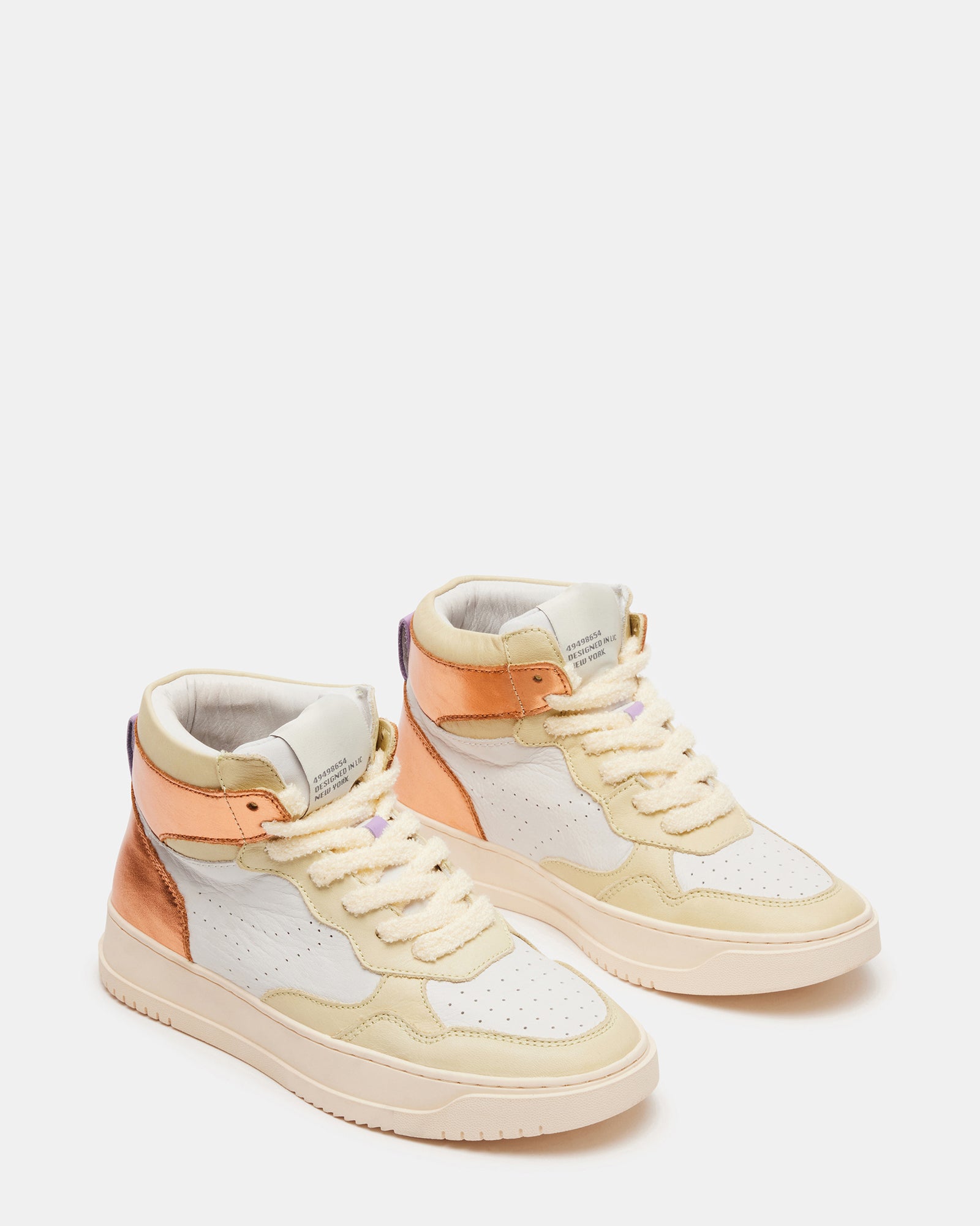 Close-up of chenille laces and perforated detailing on retro sneakers