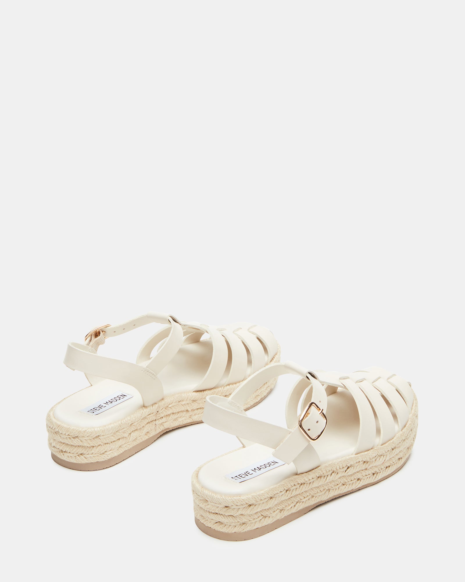 Close-up of espadrille wedge sandals with textured flatform sole