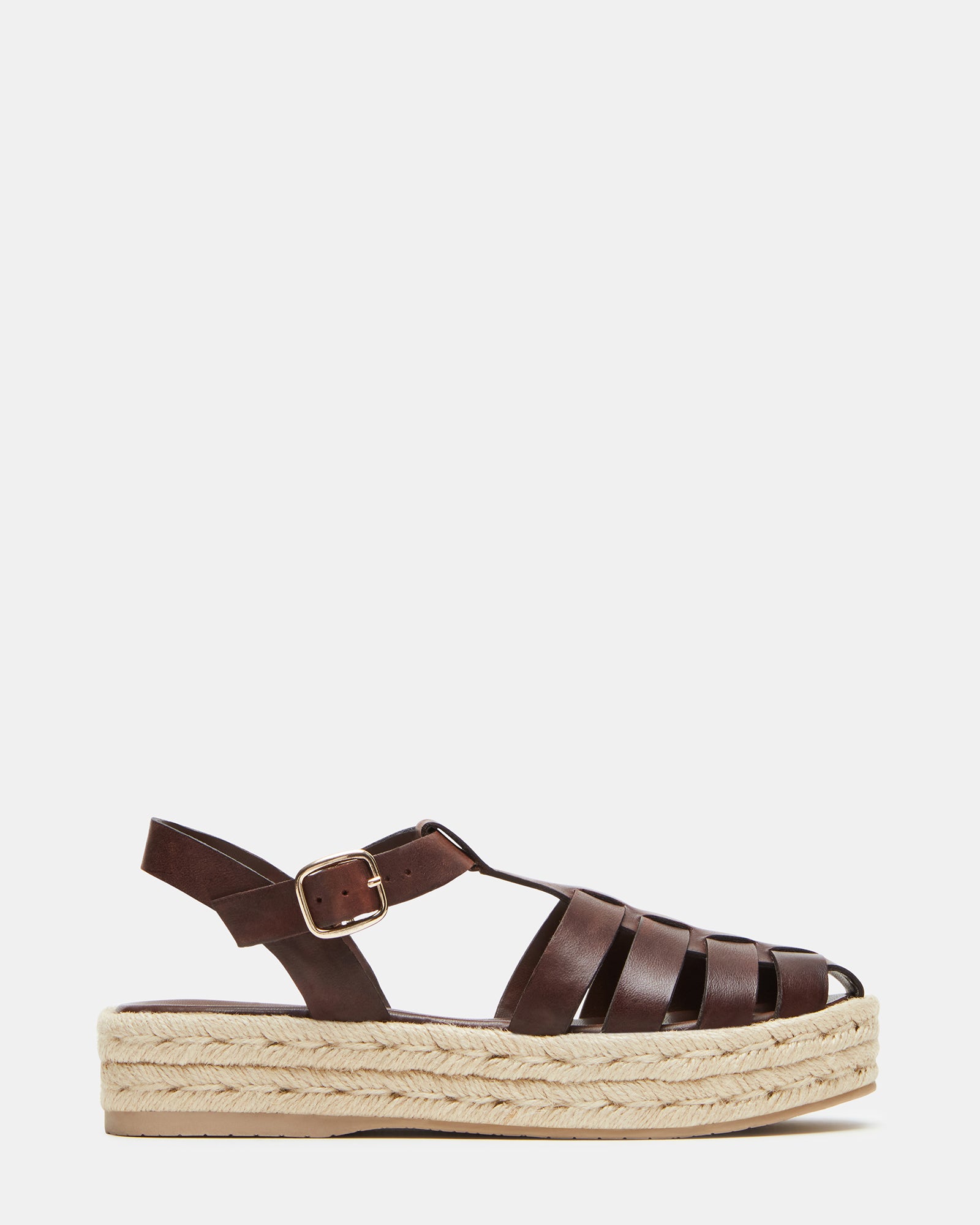 Brown leather espadrille sandals showcasing a strappy design from the side.