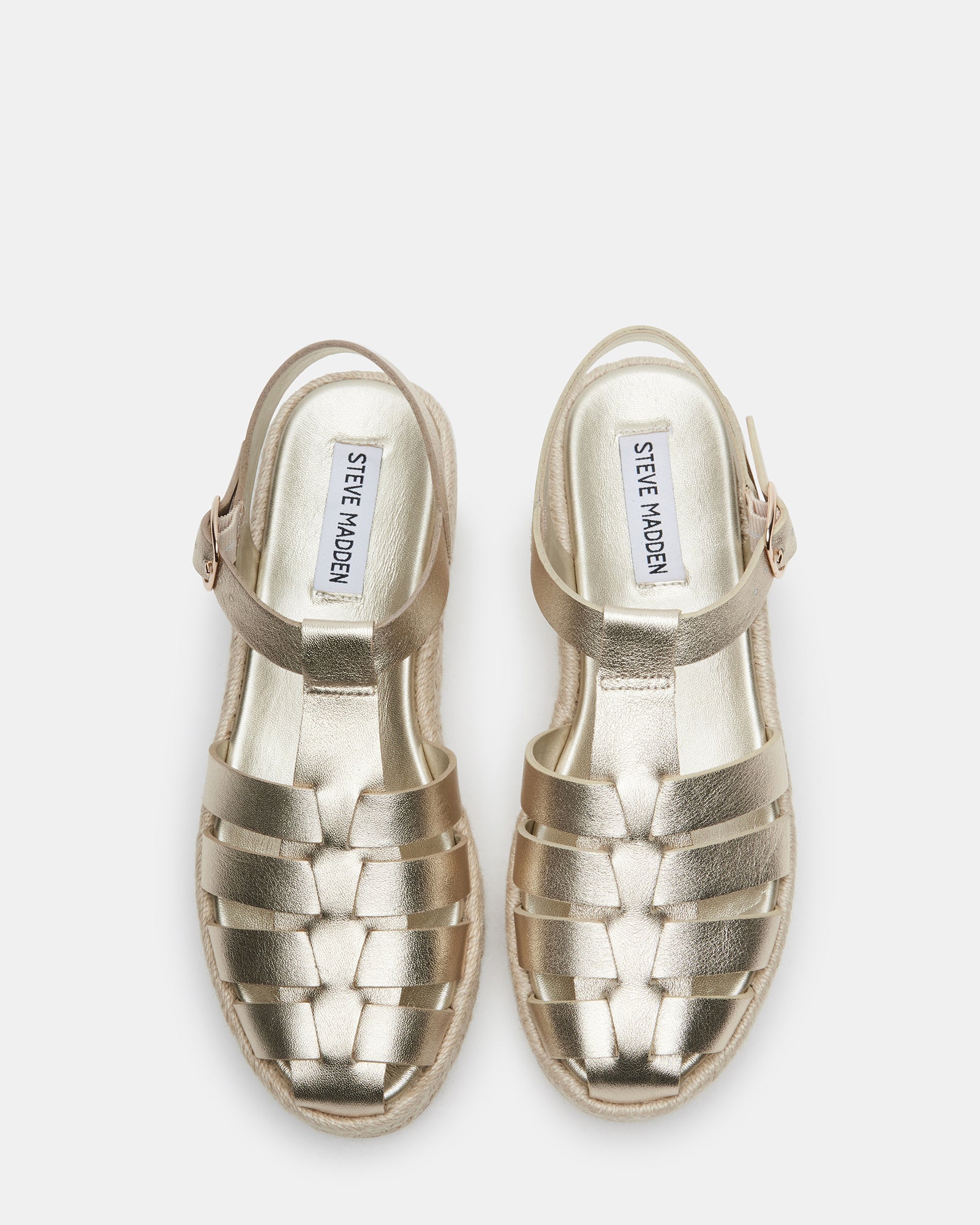 Womens Marlin gold leather sandals worn on cobblestone streets