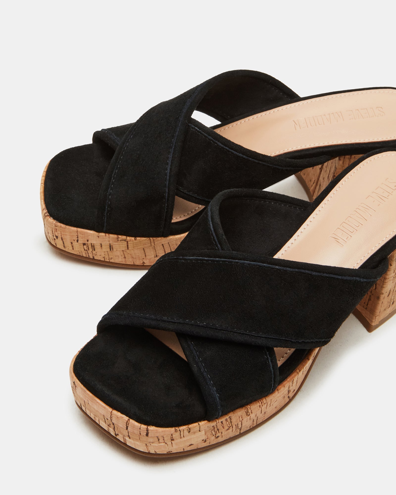 Lifestyle shot of white platform sandals styled with summer wear