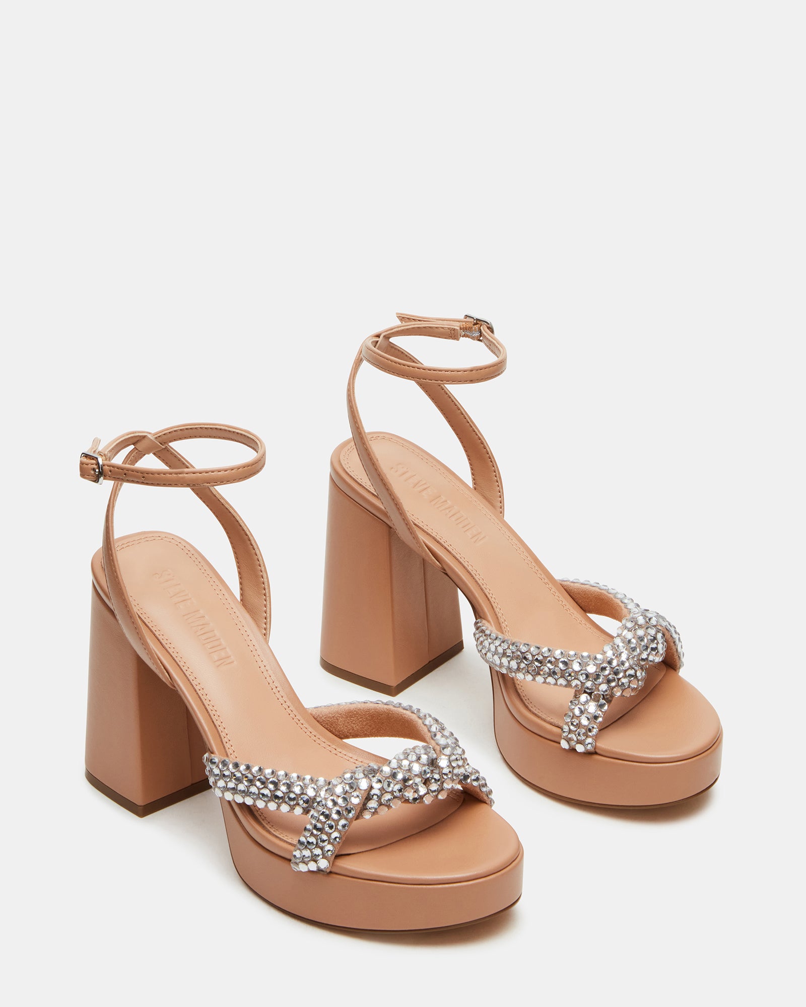 Elegant tan and multi-colored heels with a crisscross ankle strap.