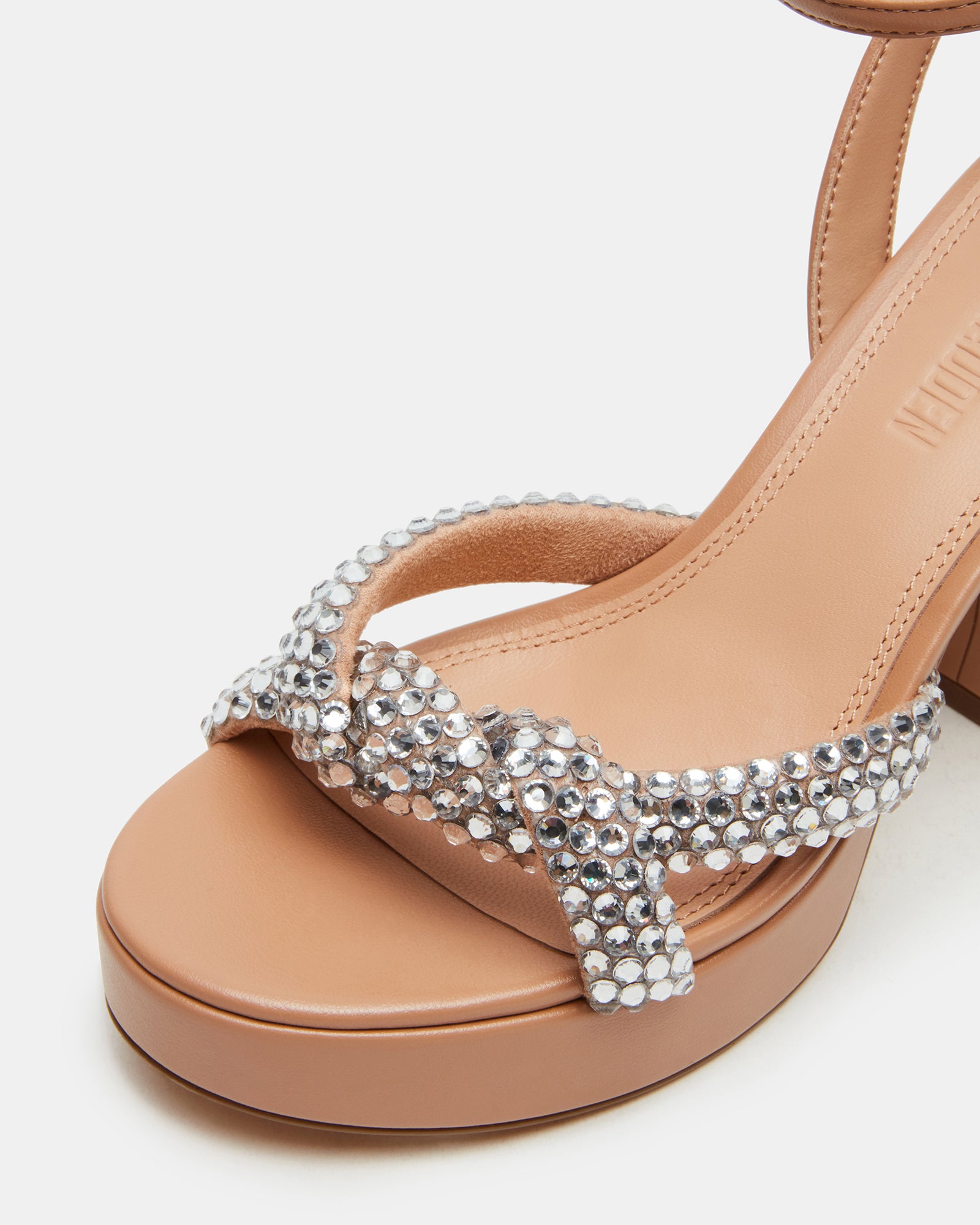 Close-up of the embellished block heels highlighting their design.