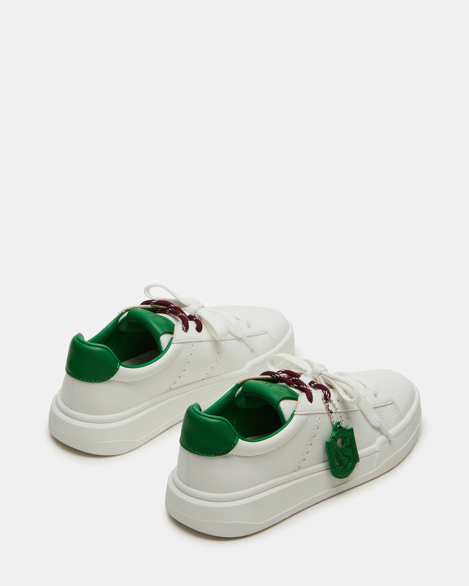 Side profile of stylish sneakers showing the synthetic sole and design