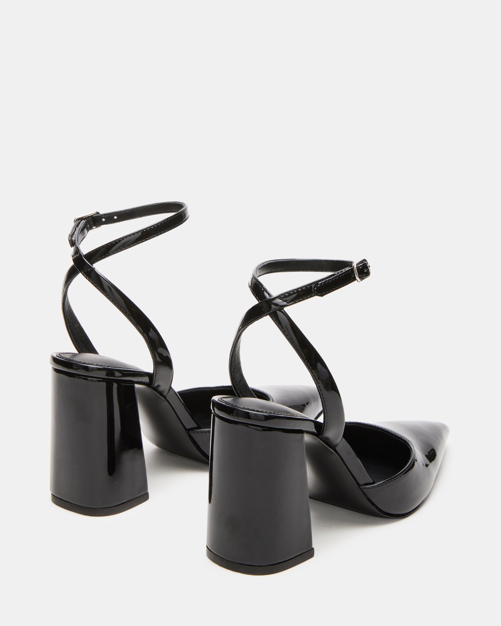 Close-up of the crisscross strap detail on MATTEA black patent heels.