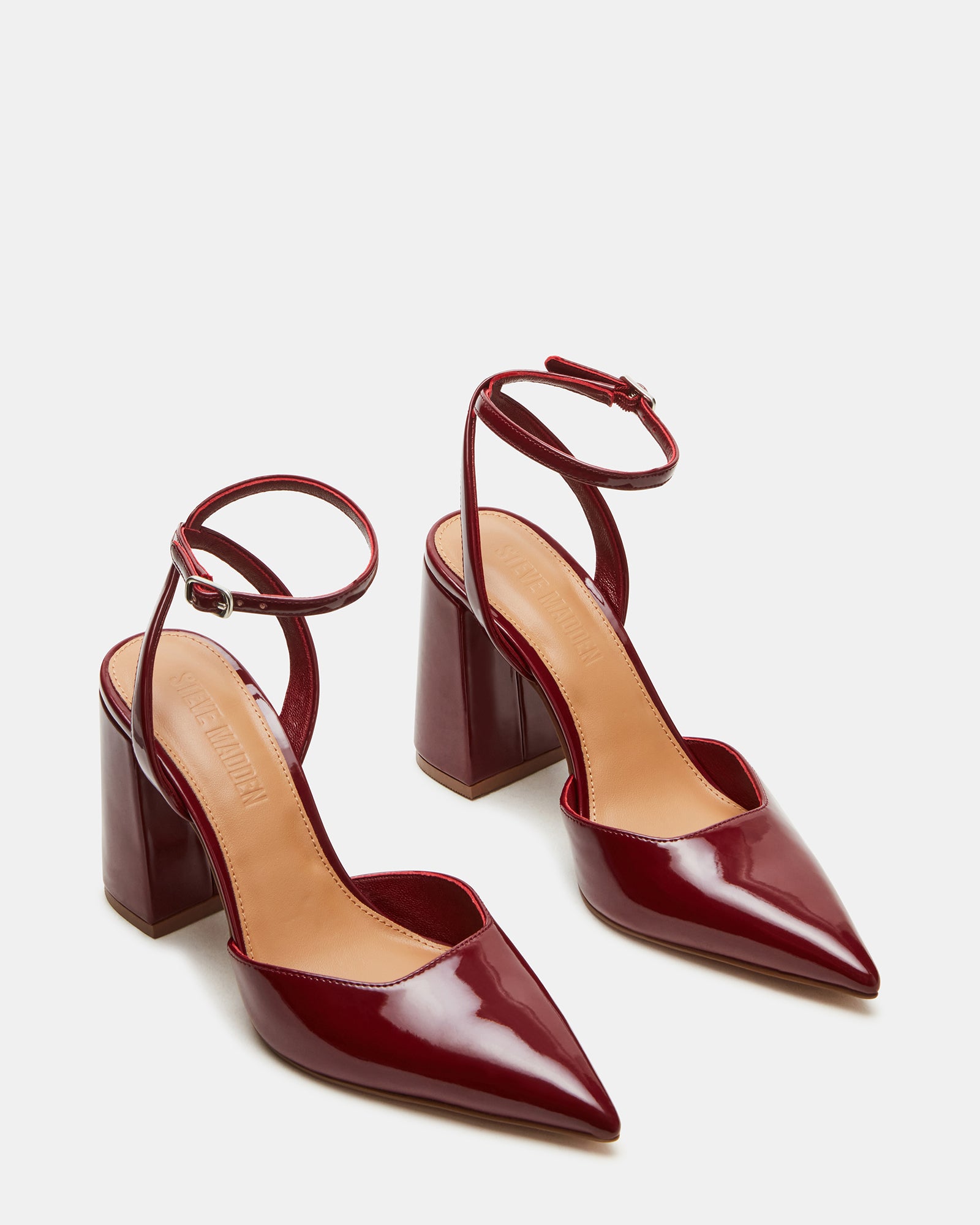 Woman wearing the heels with a chic office ensemble.