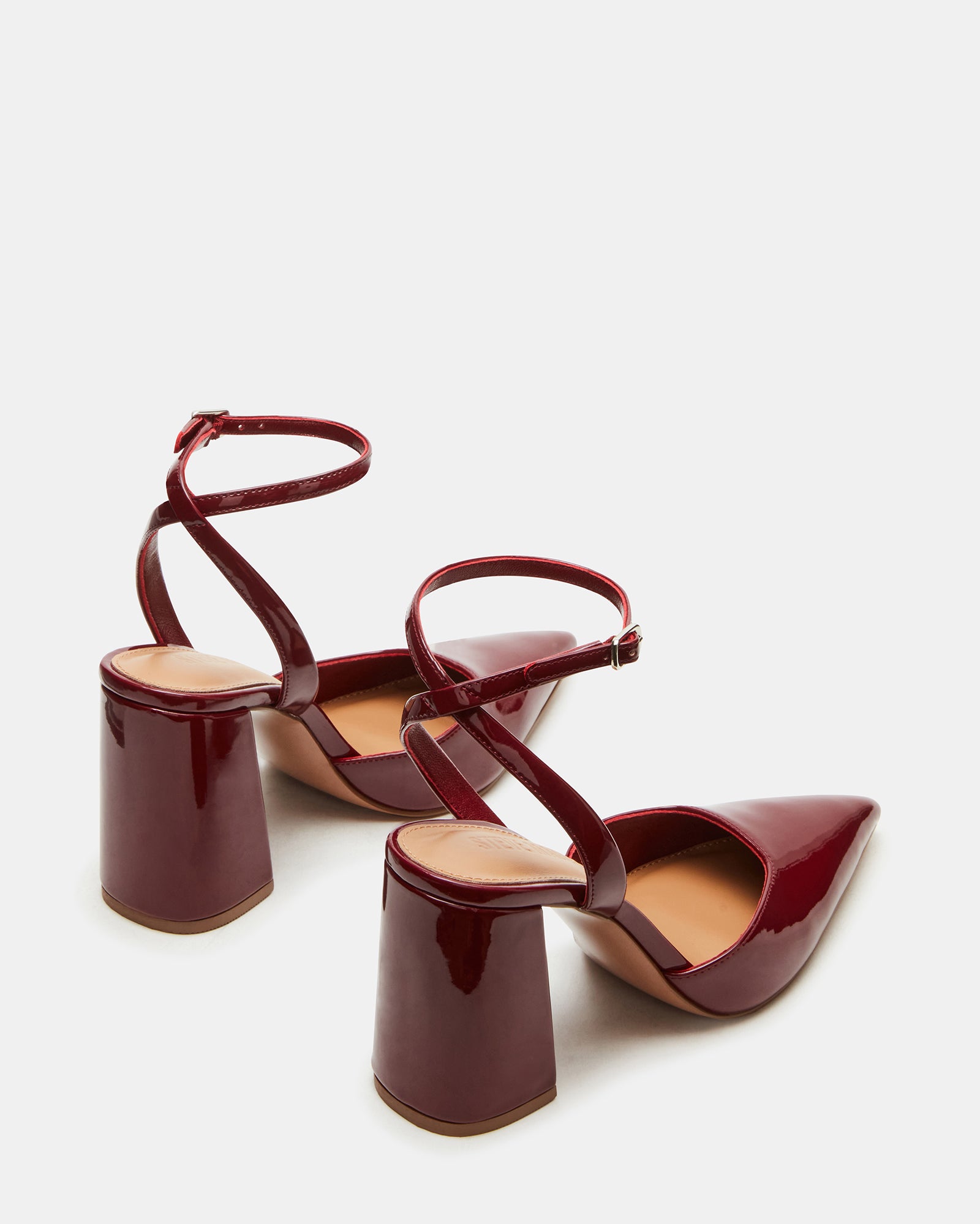 Woman wearing the heels with a chic office ensemble.
