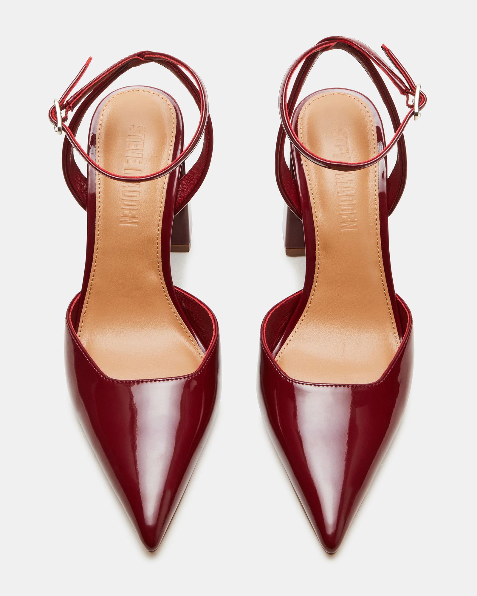 Close-up of the gold-accented block heel and pointed toe.