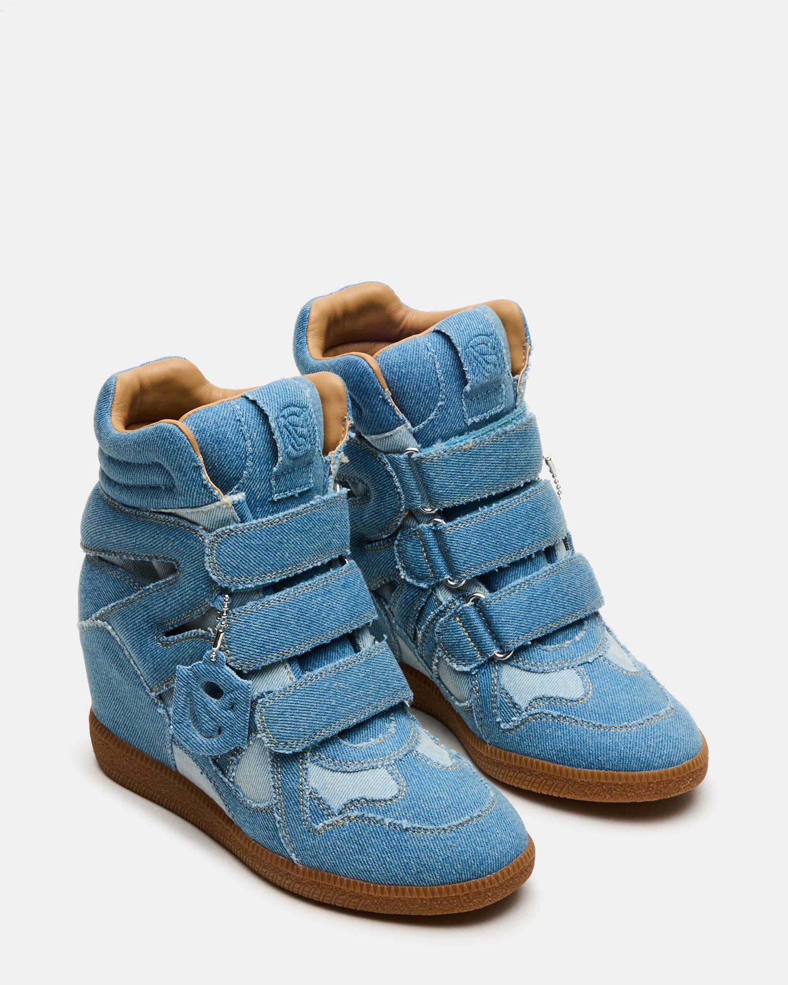 Side angle of trendy black high top sneakers highlighting the sleek denim design
