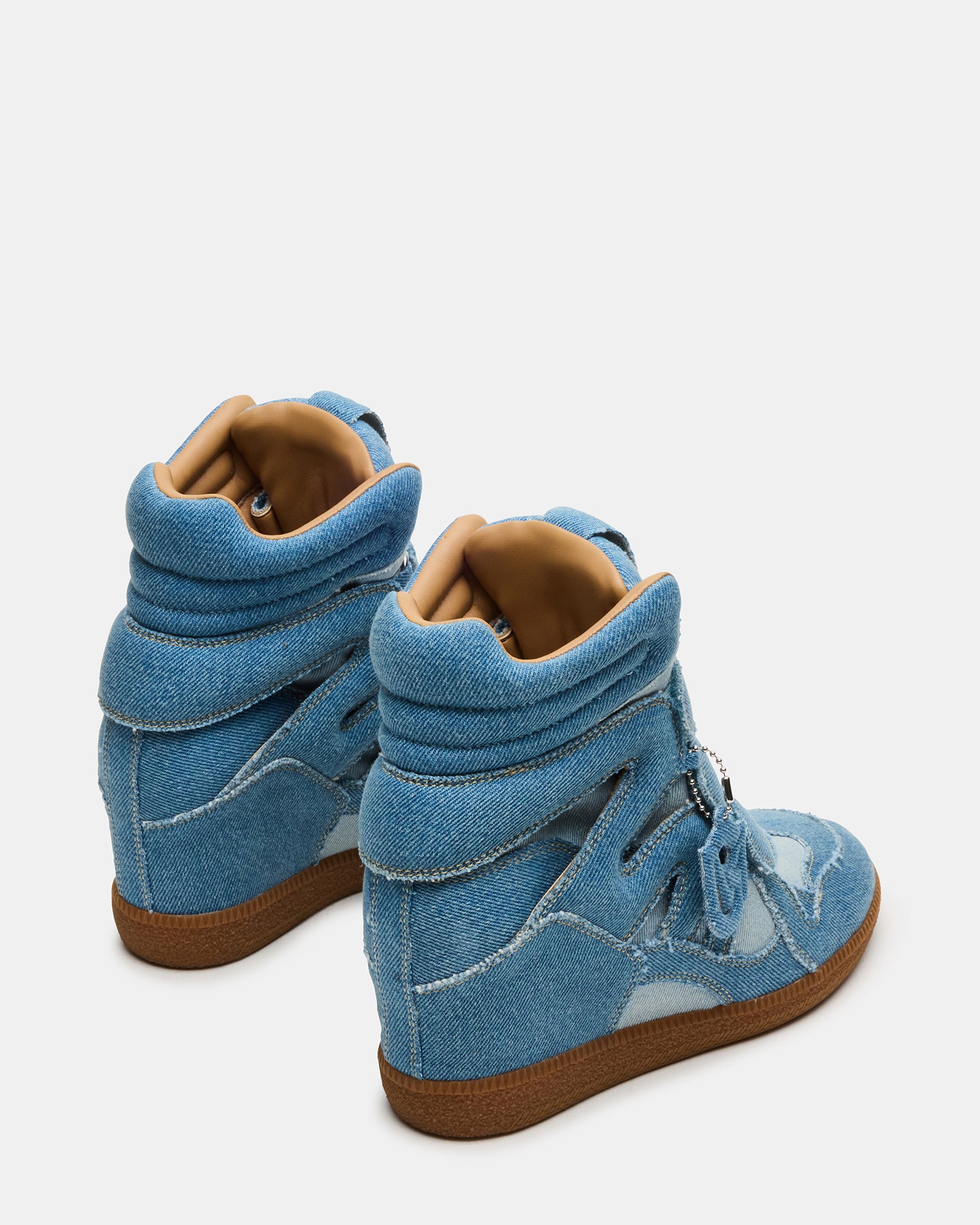 Side angle of trendy black high top sneakers highlighting the sleek denim design