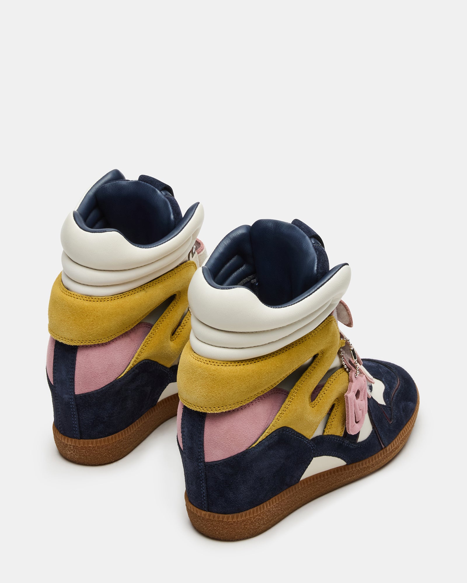 Close-up of Velcro straps on womens wedge sneakers, showcasing adjustability.