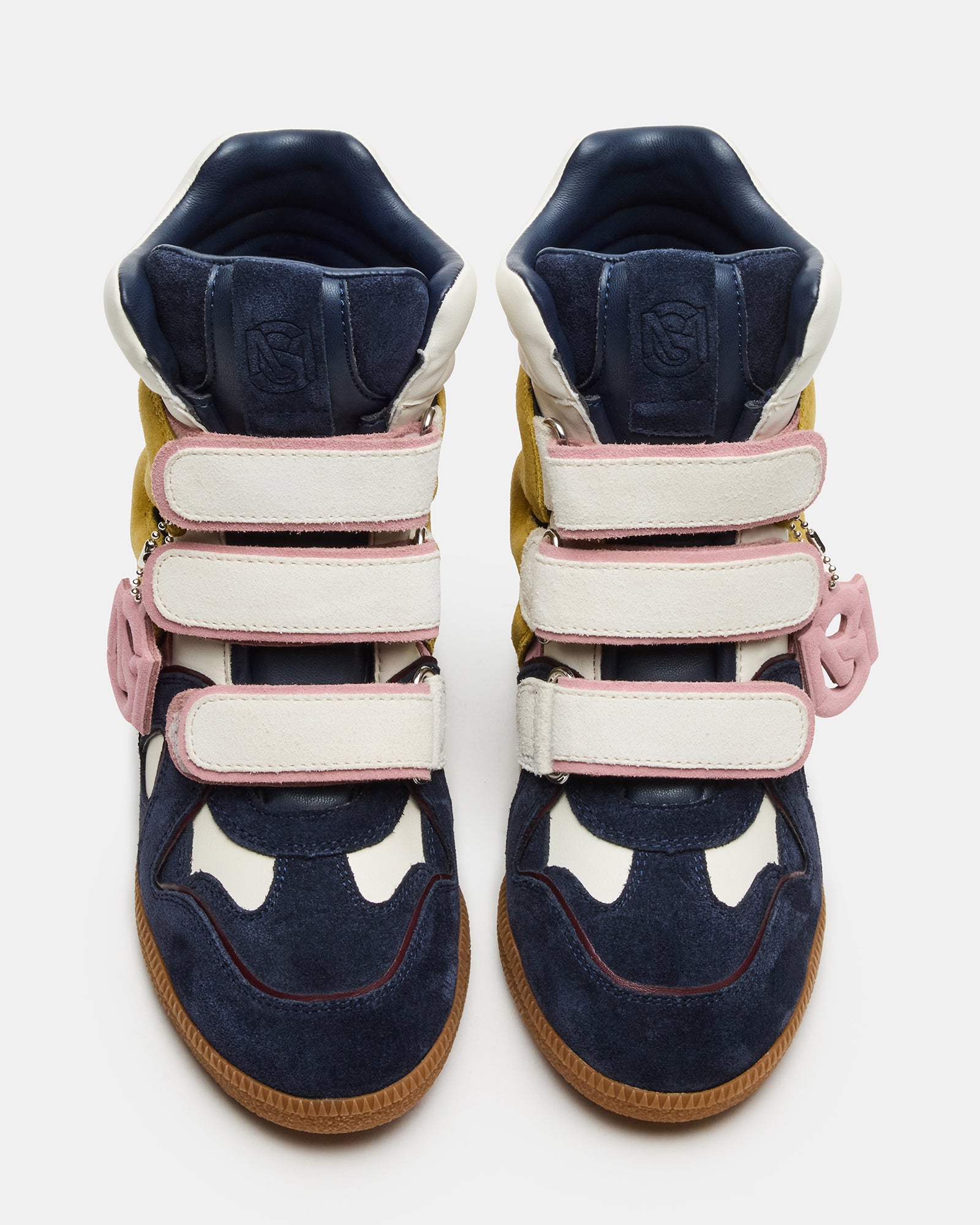 Mavis navy suede high-top sneakers for women, front angle on urban sidewalk.