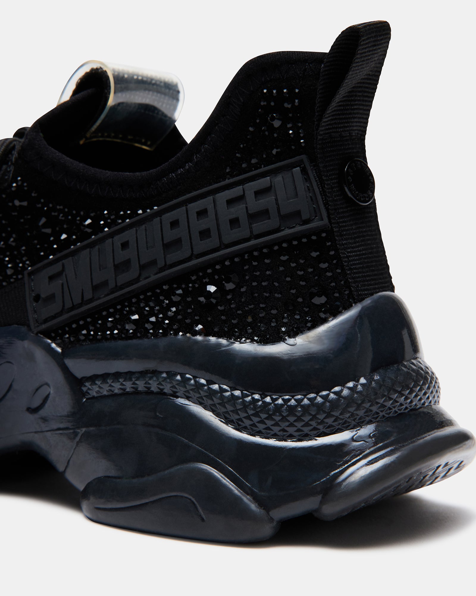 Black rhinestone fashion sneakers showcasing a side view.