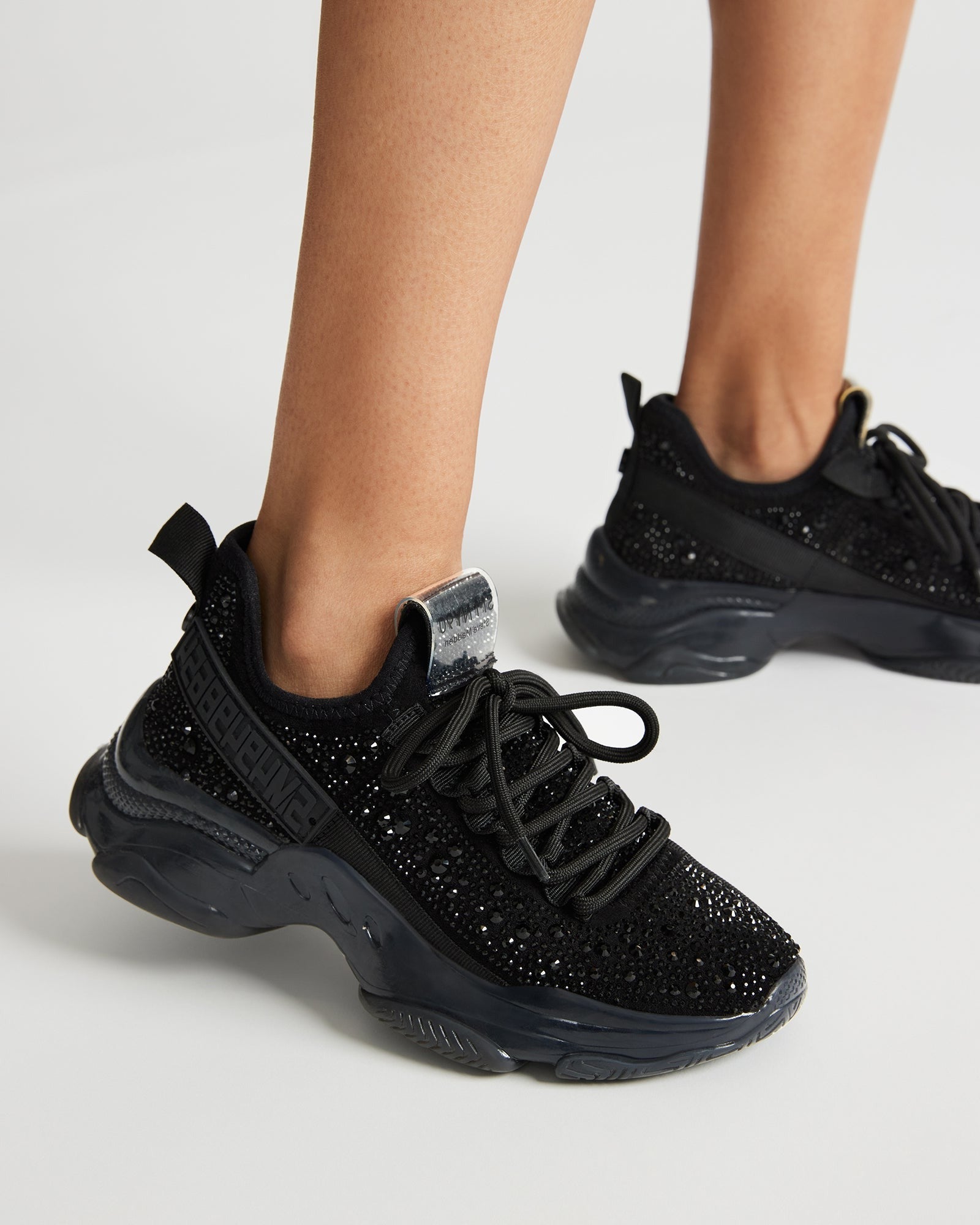 Comfortable lace-up design of the black rhinestone sneakers.