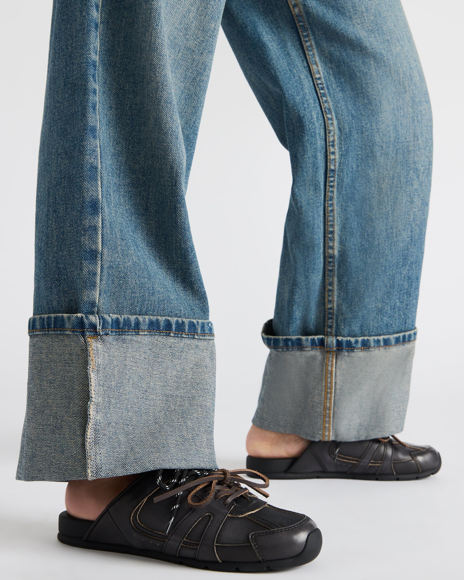 Top-down angle of slip-on shoes showing textile lining and secure lace-up detail