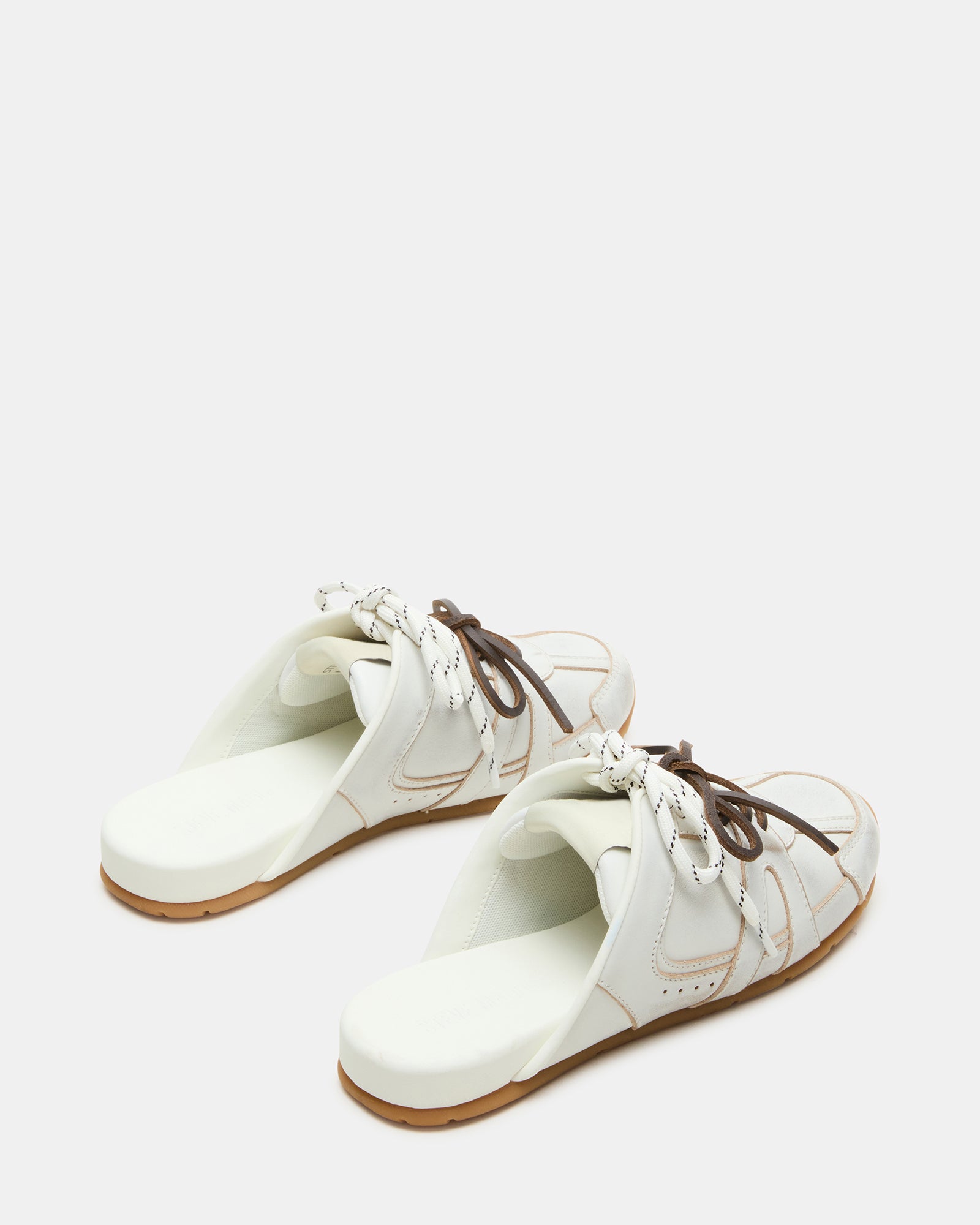 Top-down view of slip on sneakers for women styled with denim and tote bag, ideal for weekend wear.