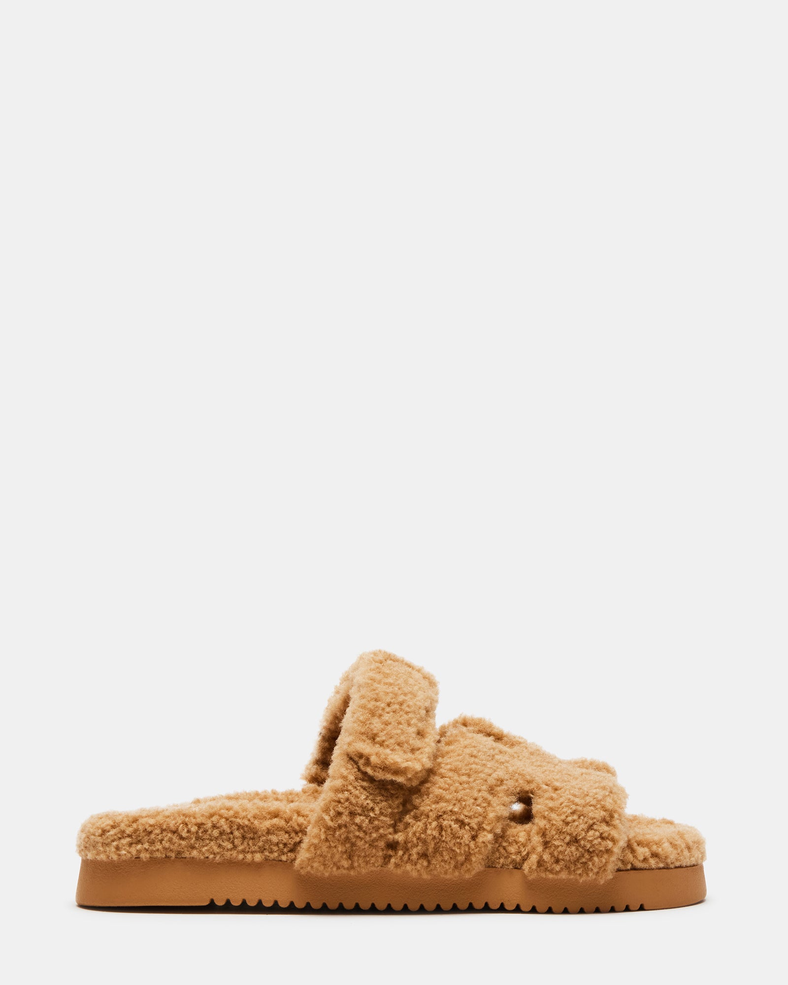 Mayven faux shearling slides styled with jeans for a casual outing.