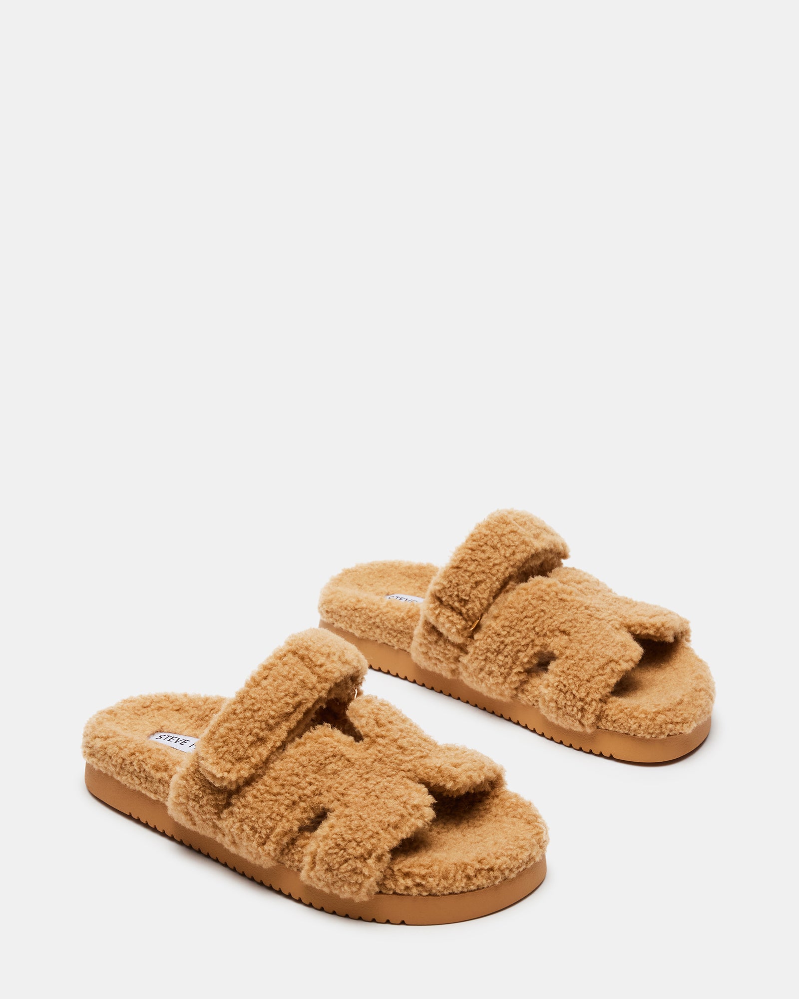 Flatform slip-on shoes showcased from a side angle highlighting the heel height.