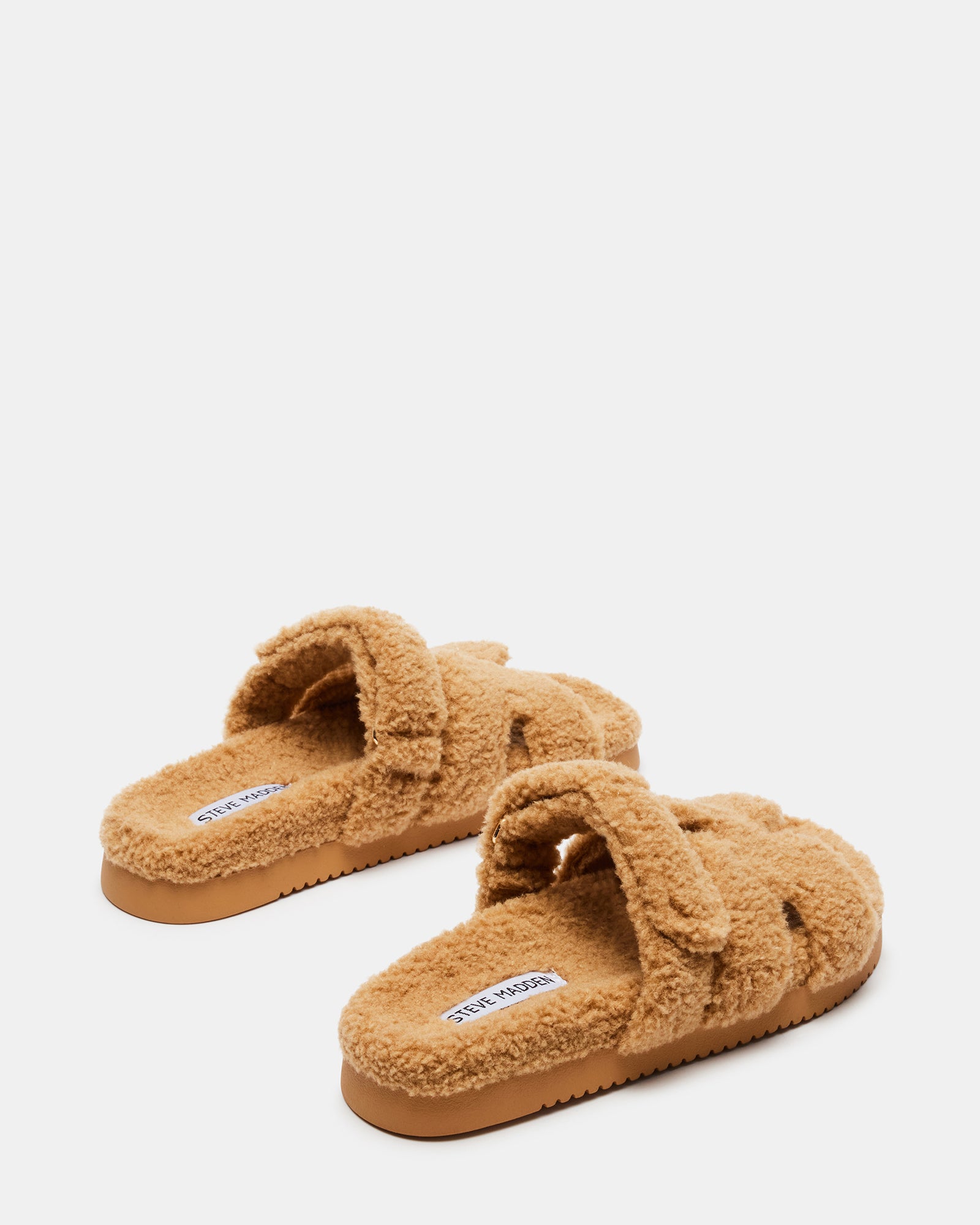 Flatform slip-on shoes showcased from a side angle highlighting the heel height.