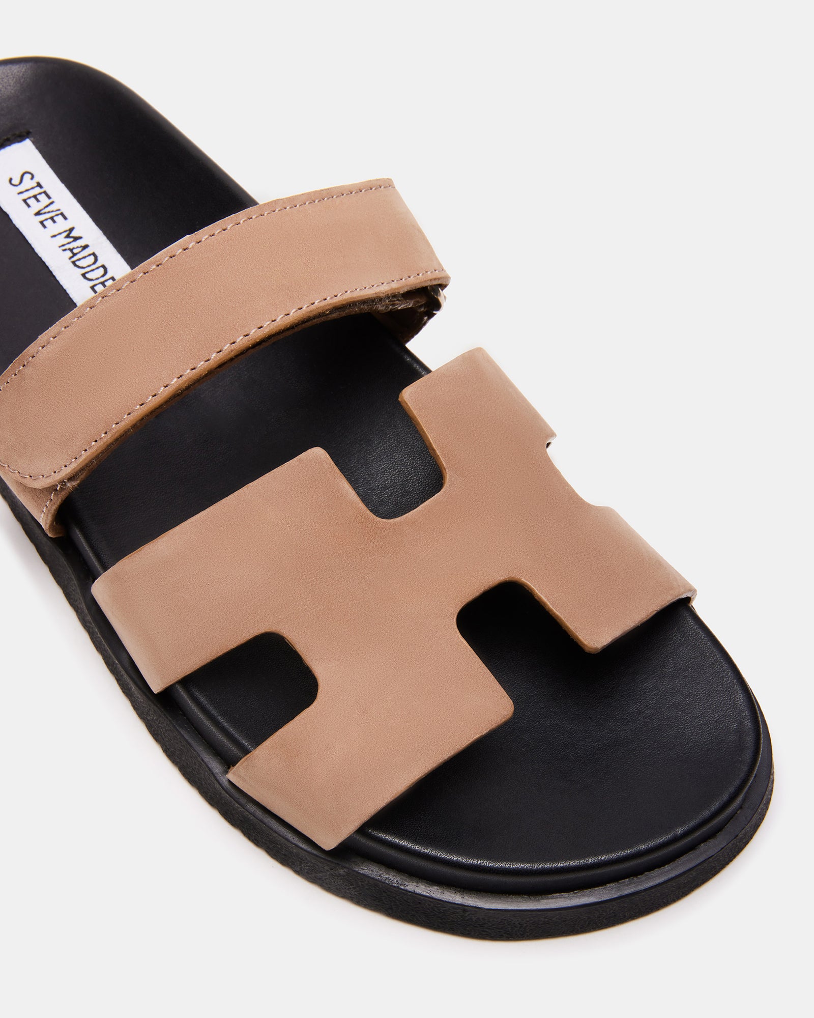 Side view of tan nubuck slide sandals showing flatform sole and strap design