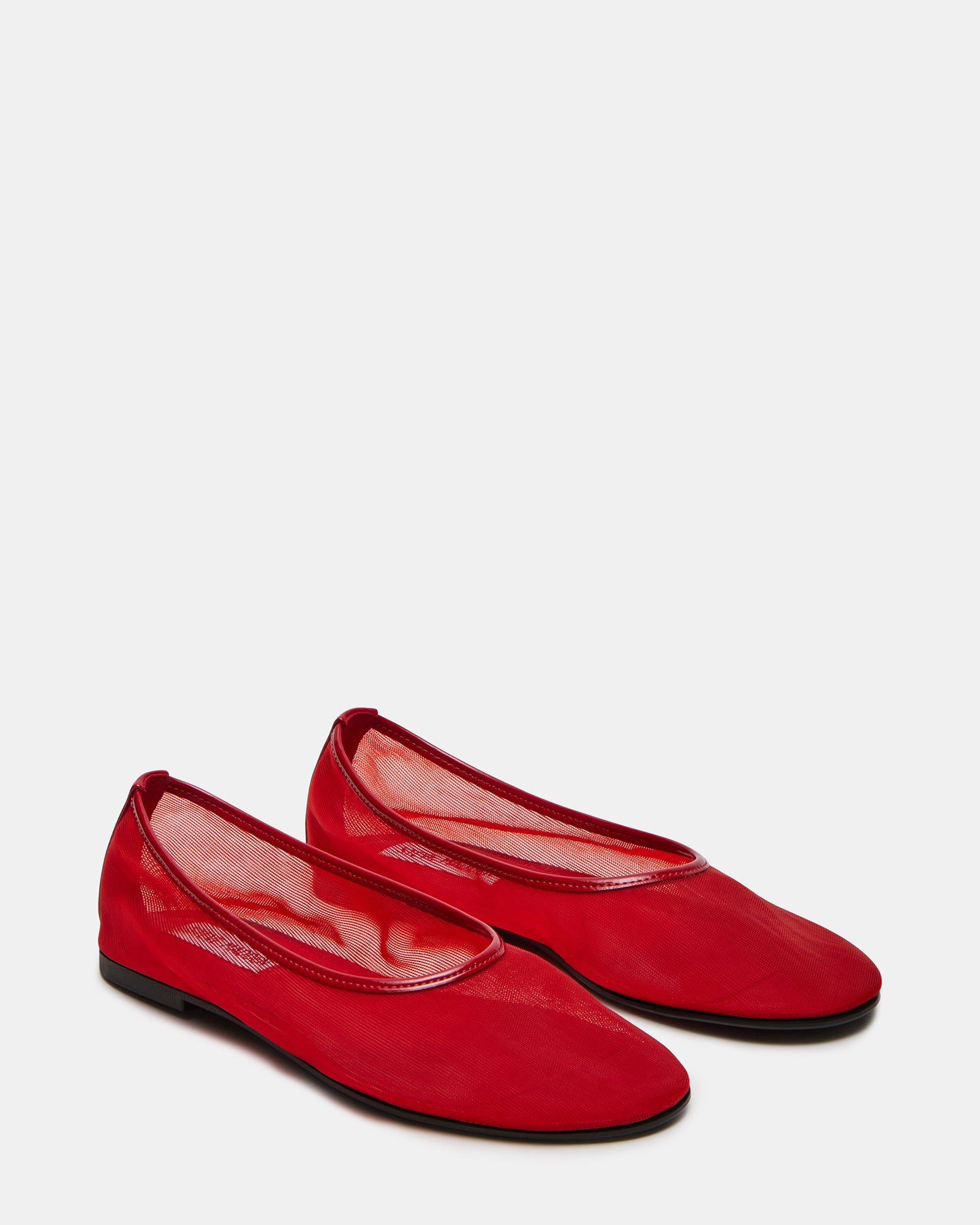 Woman wearing red ballet flats with casual outfit, ideal for daily wear