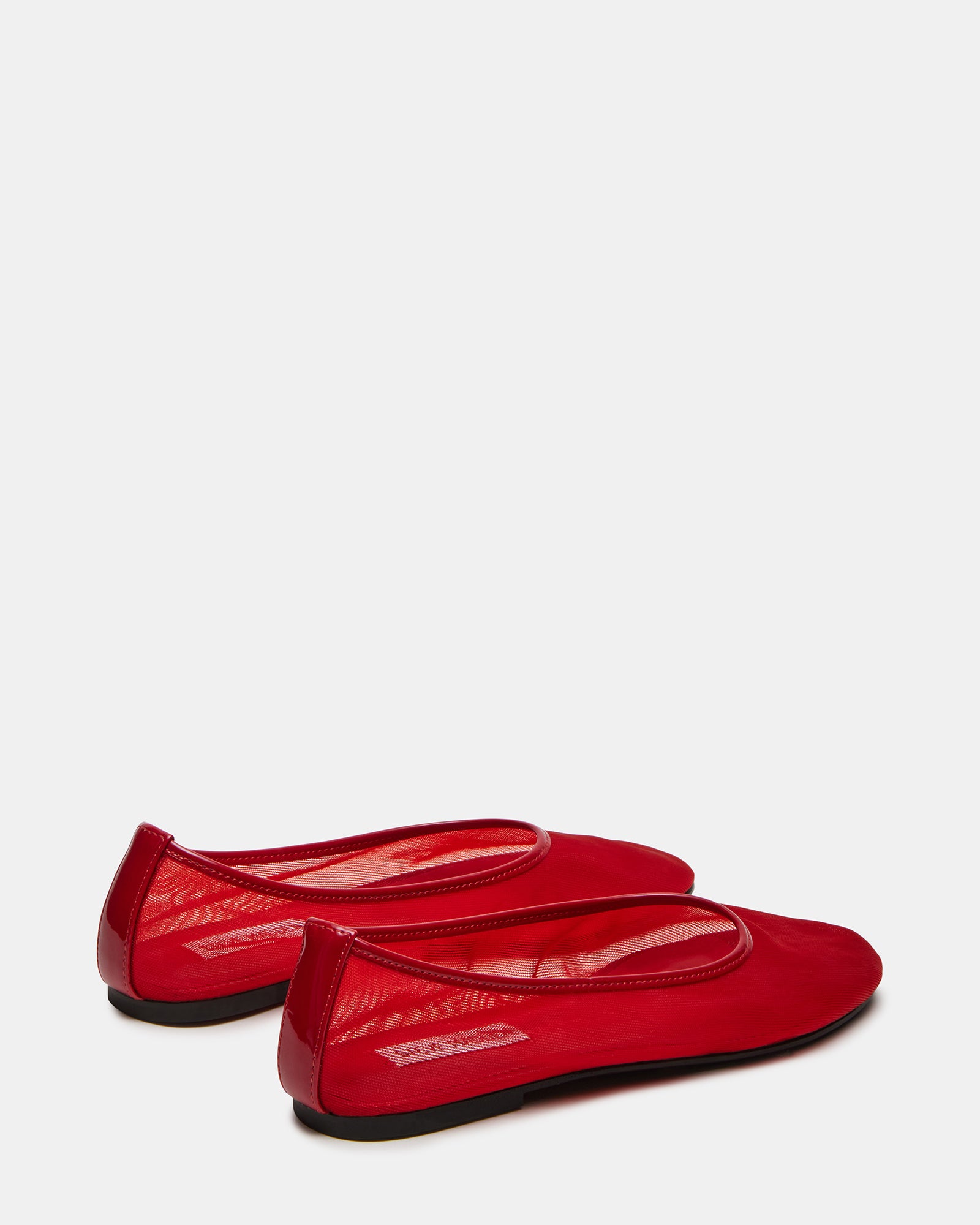 Woman wearing red ballet flats with casual outfit, ideal for daily wear
