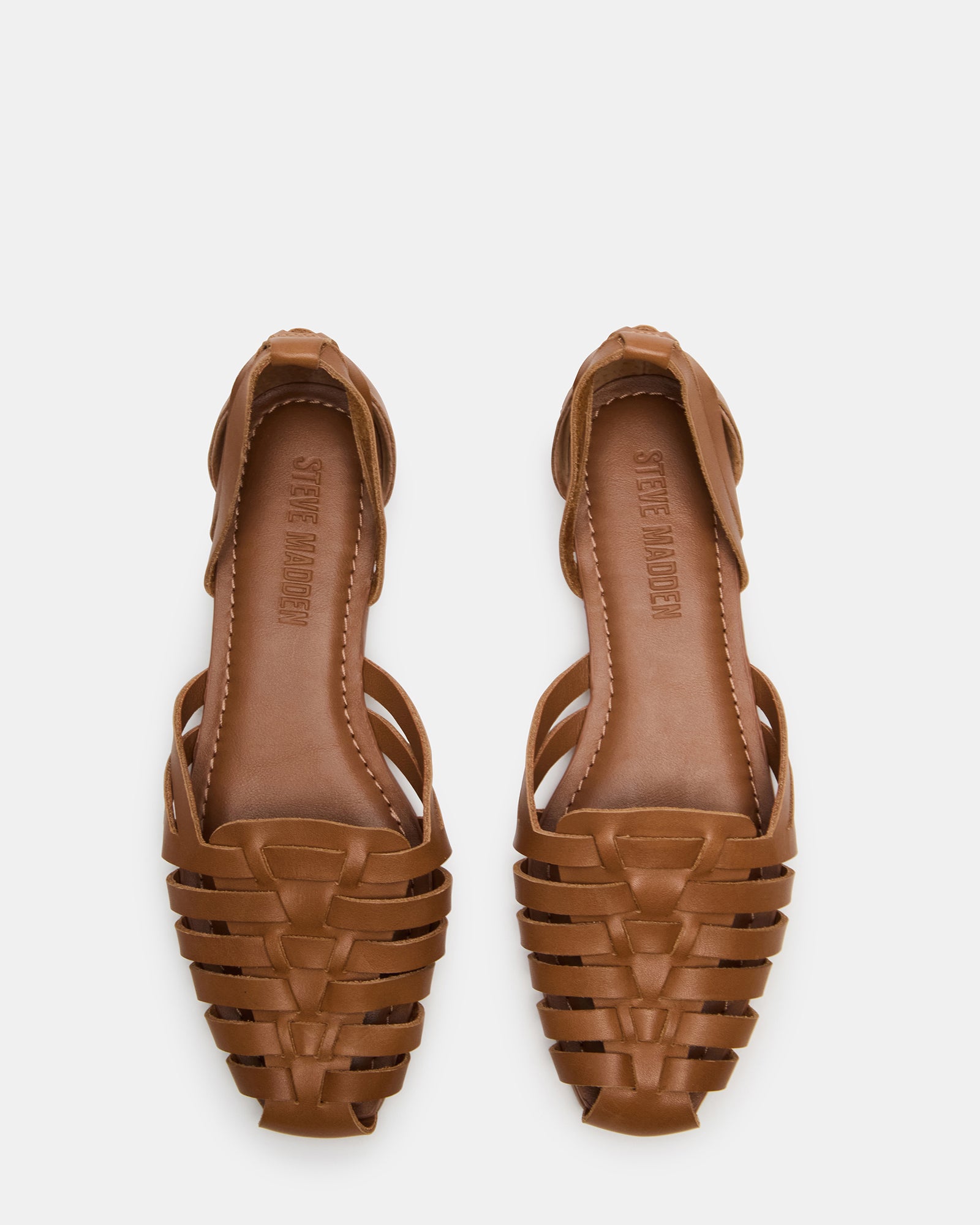 Medlin tan leather flats with square toe on a city sidewalk, stylish and comfortable for everyday use