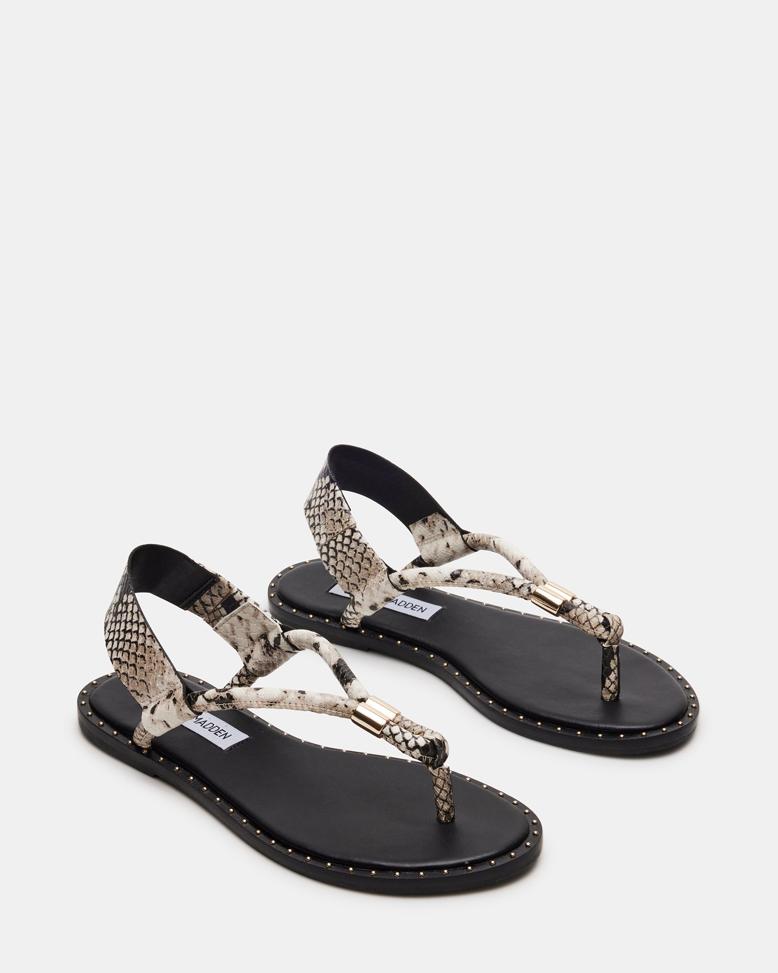 Side view of edgy Meduza Snake thong sandals highlighting the studded design